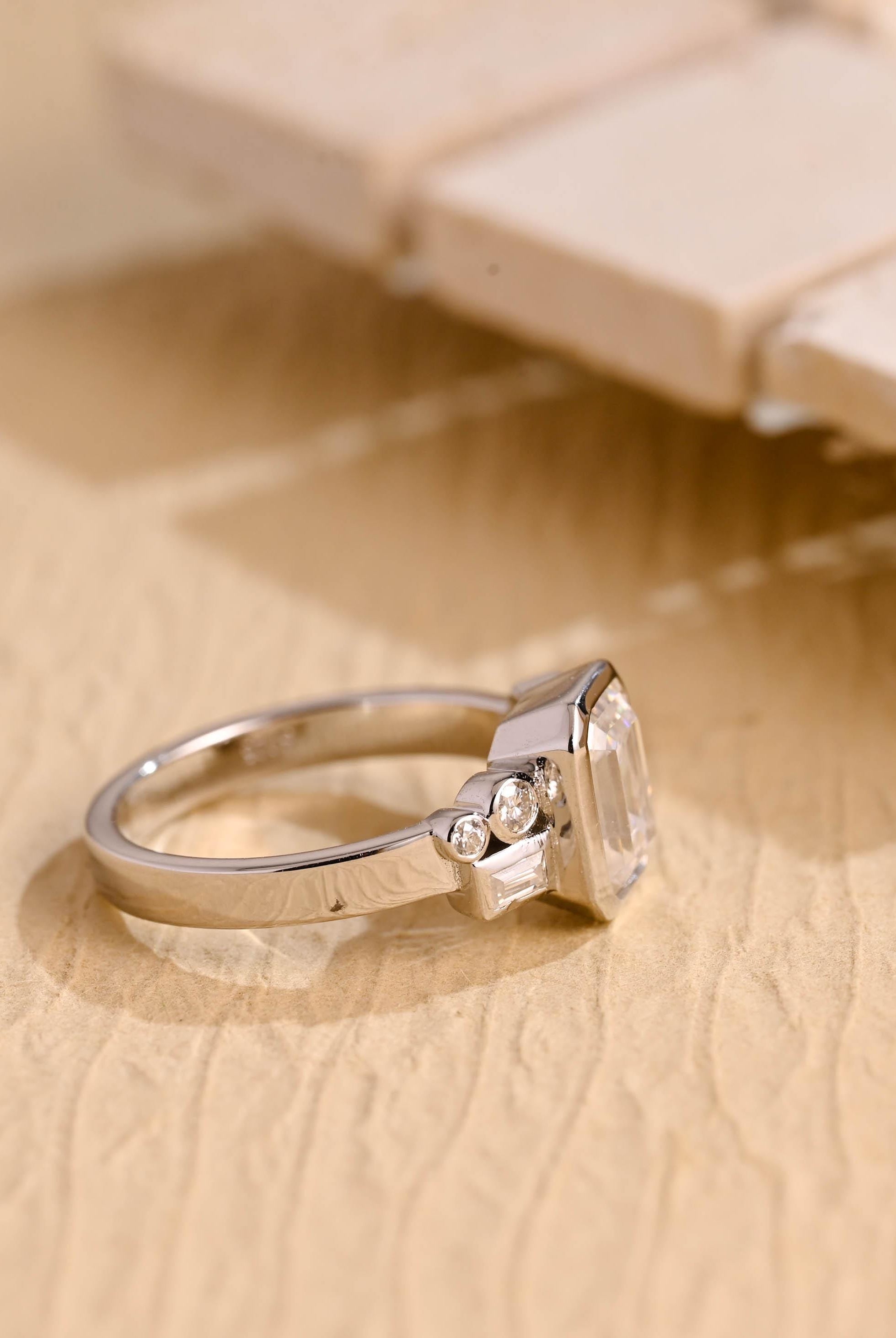 minimalist emerald bezel cluster moissanite engagement ring