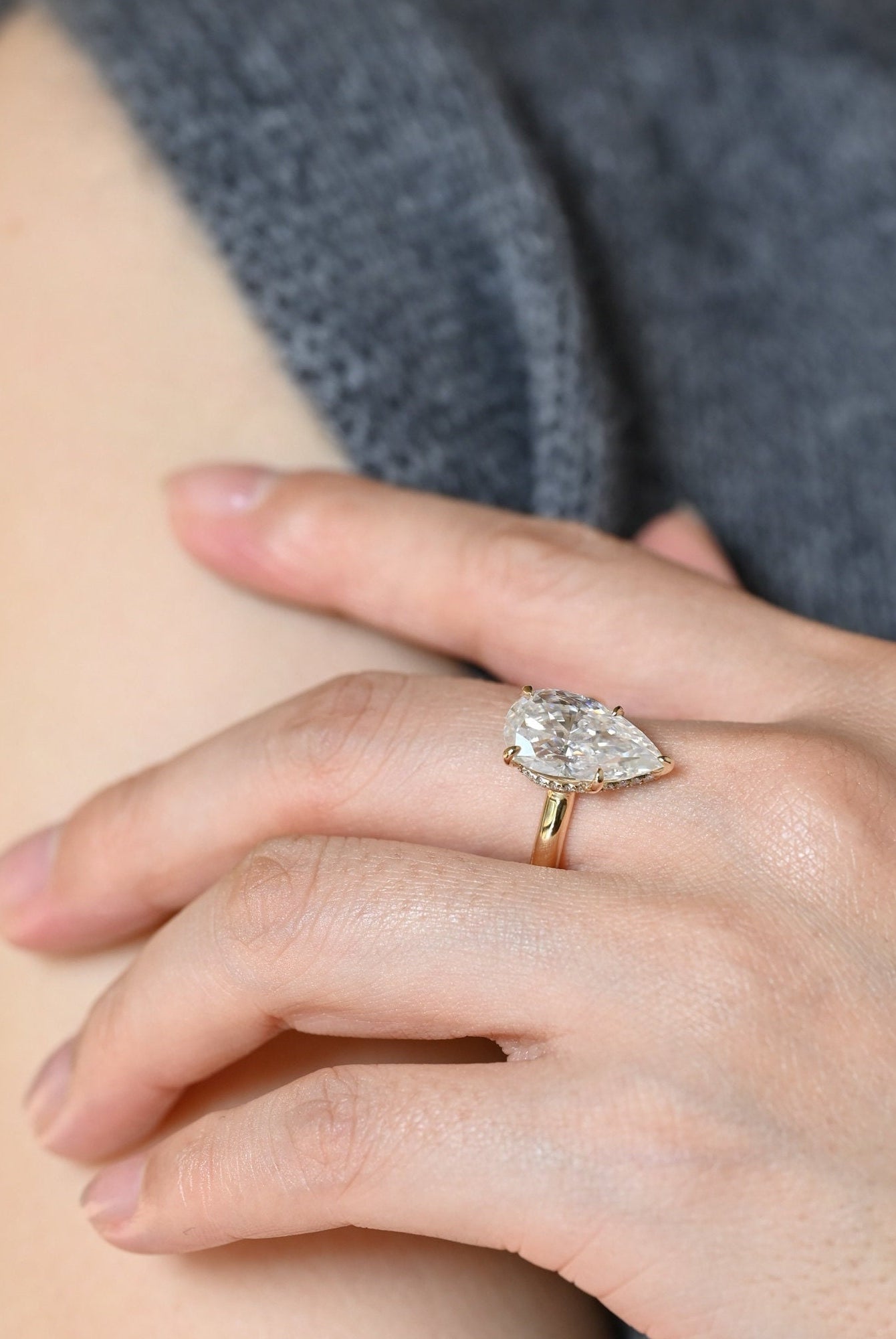 sparkling pear hidden halo engagement ring moissanite