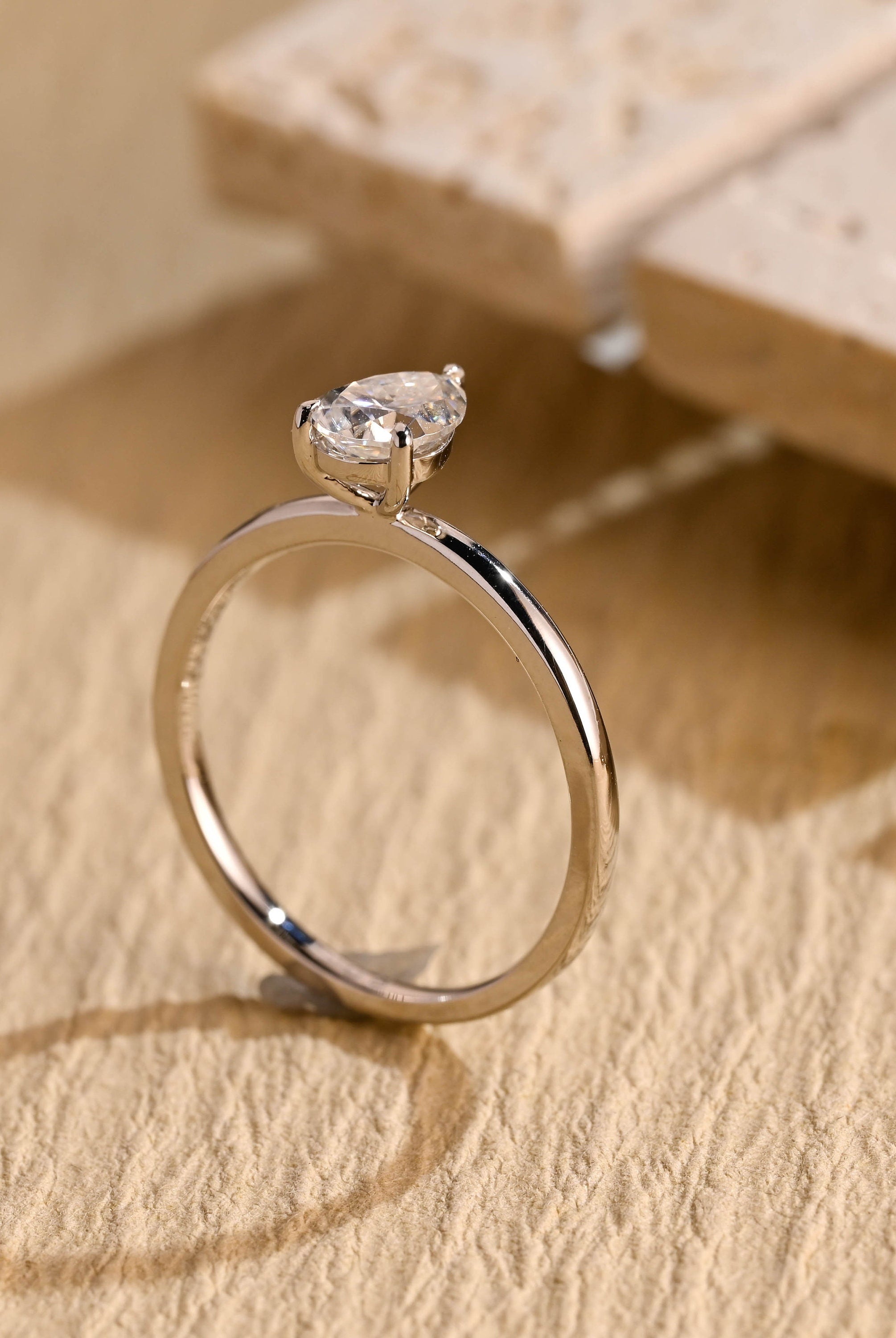 sustainable pear solitaire engagement ring moissanite
