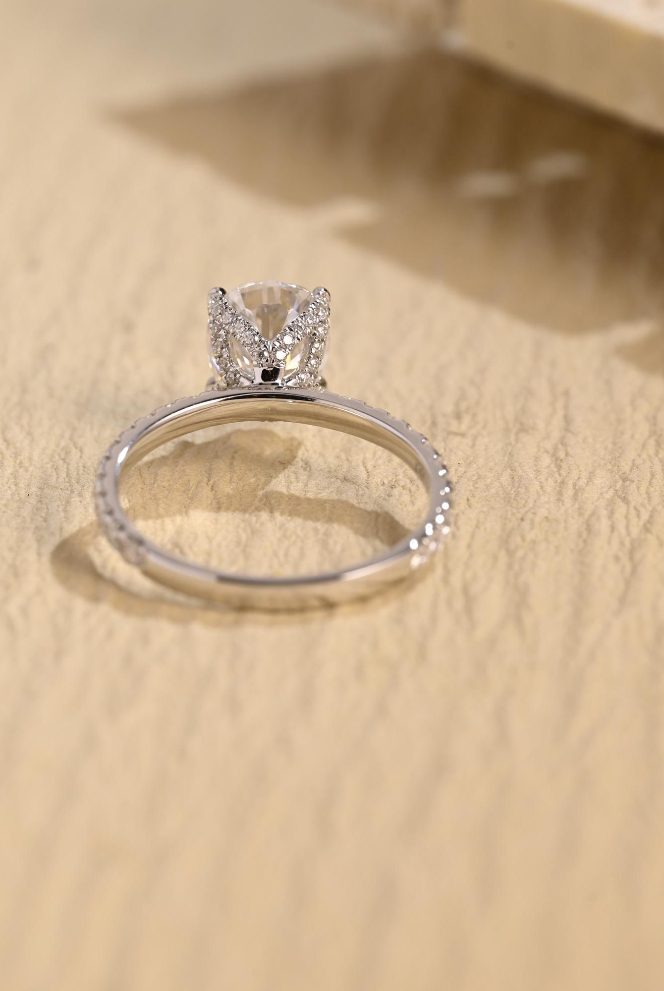 pavé band pear cut moissanite engagement ring
