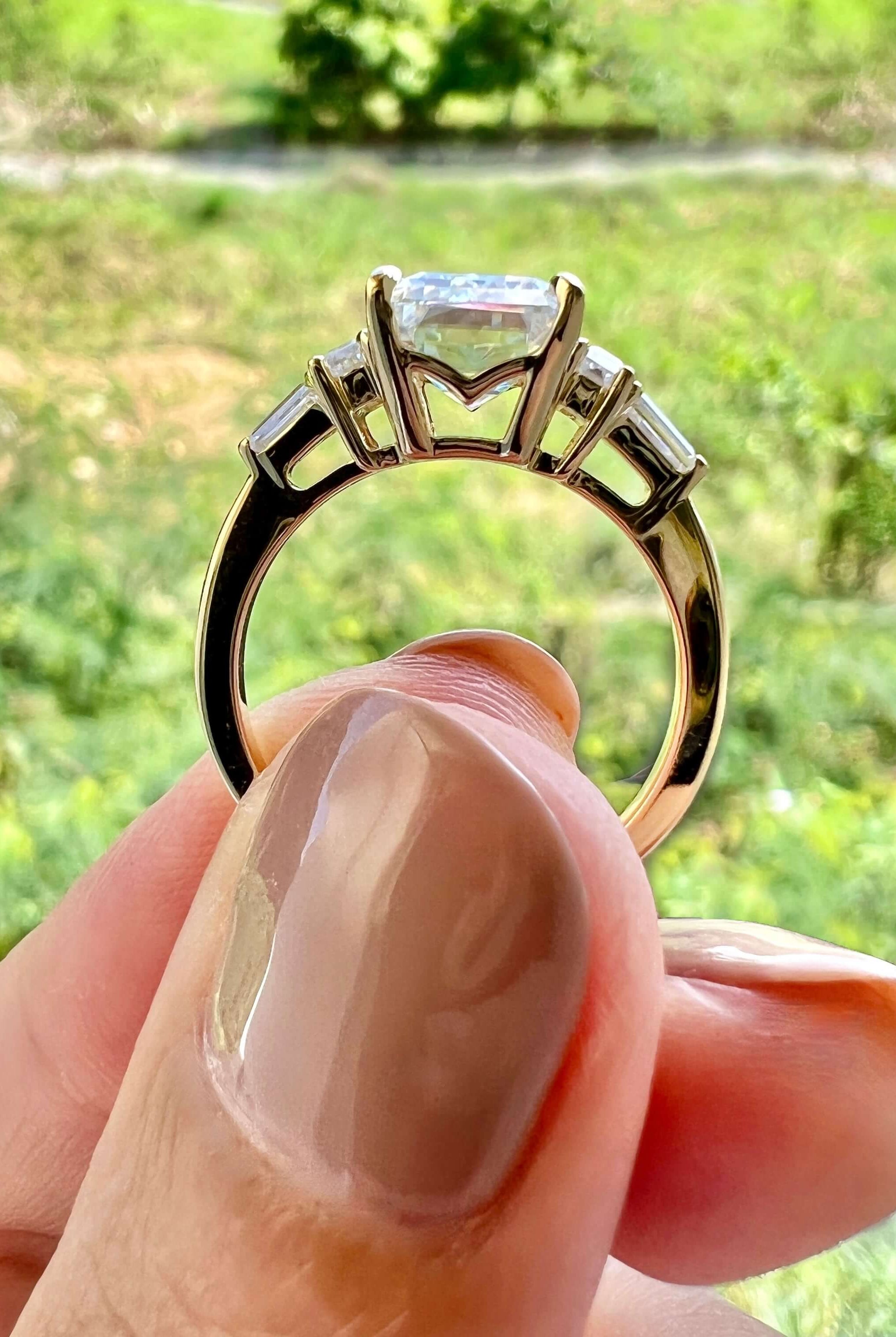 emerald-cut-3-stone-moissanite-engagement-ring