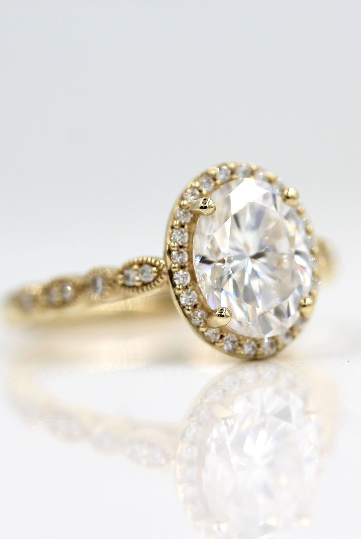 Moissanite solitaire engagement rings with diamond accents