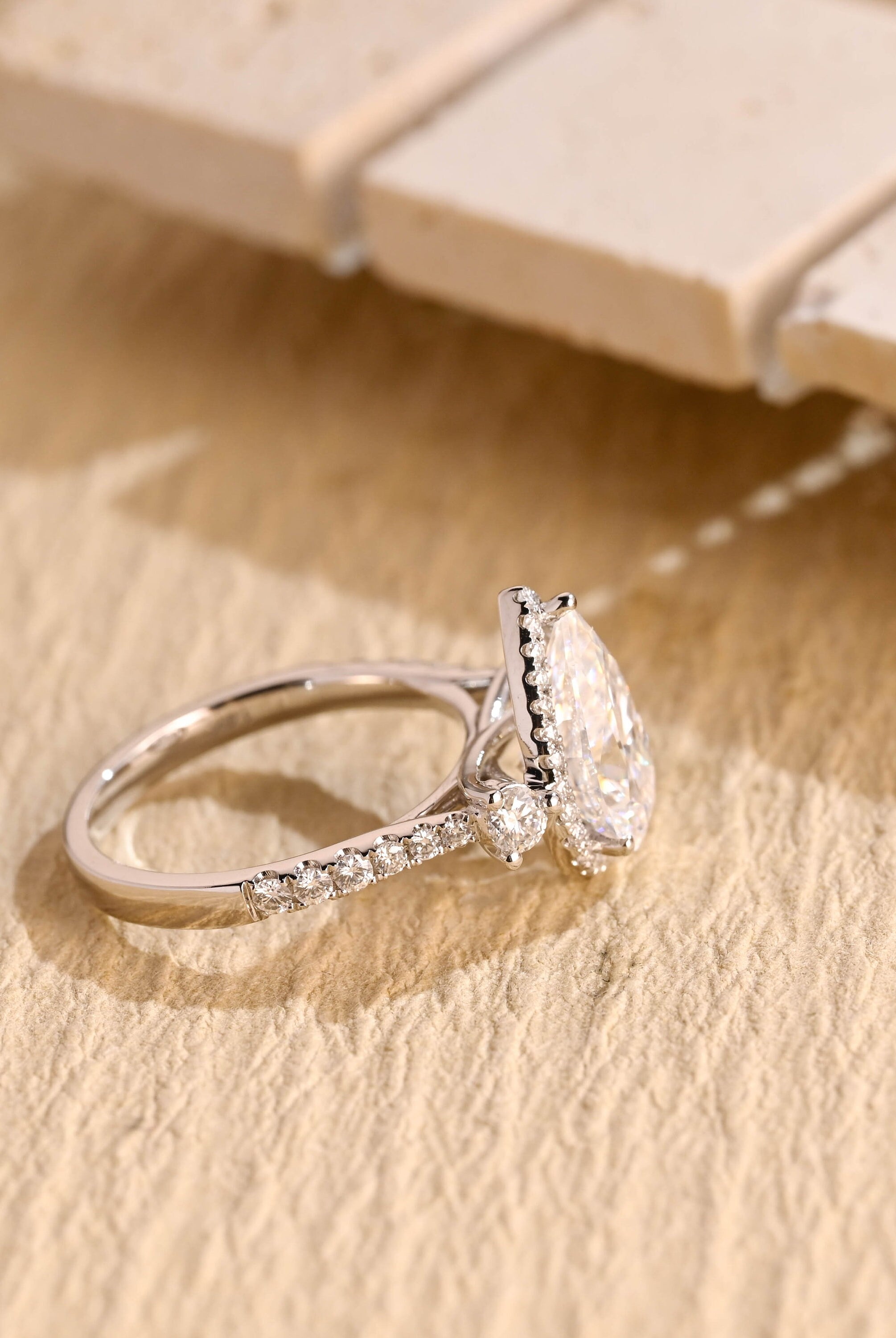 designer pear three stone engagement ring moissanite