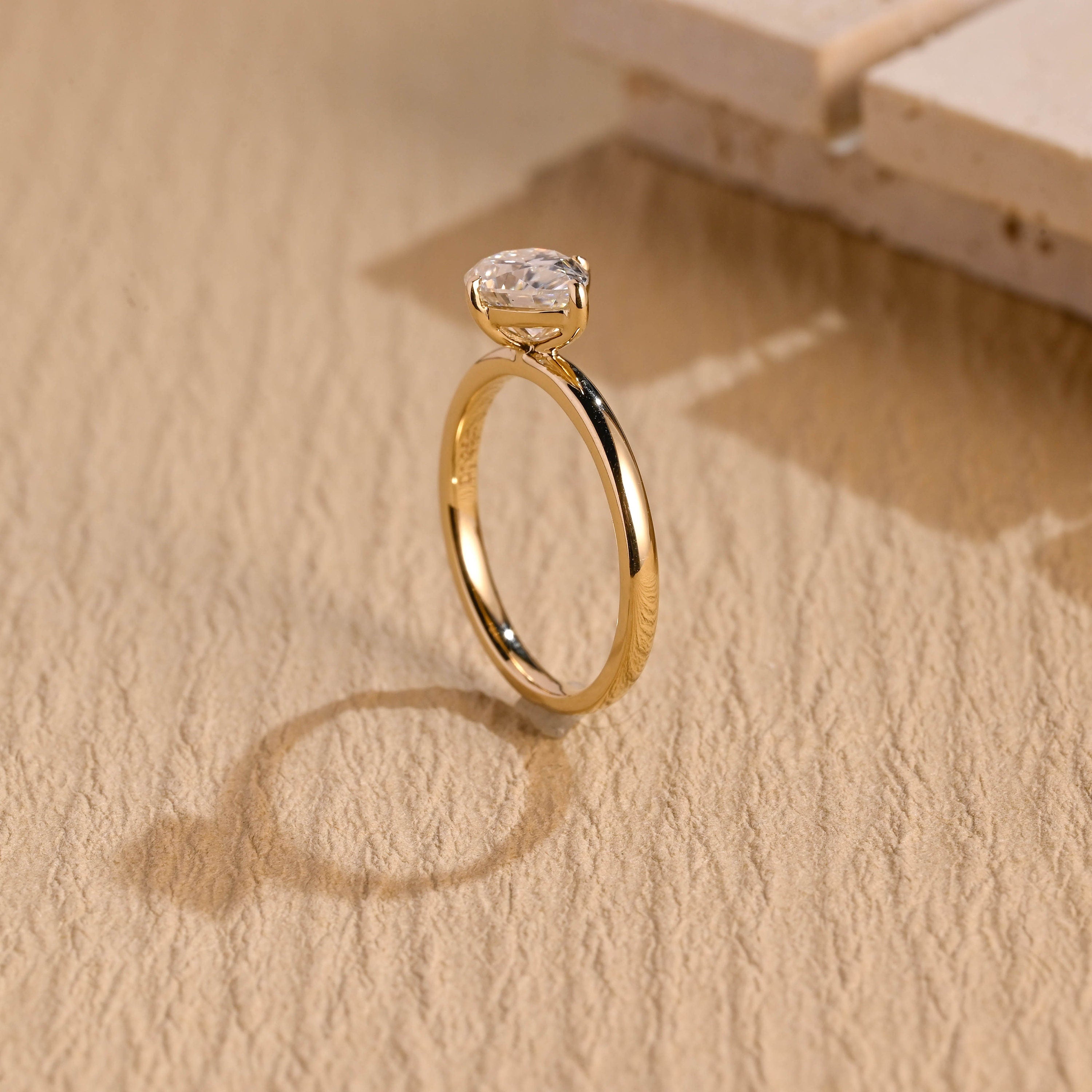 designer east west pear solitaire moissanite ring