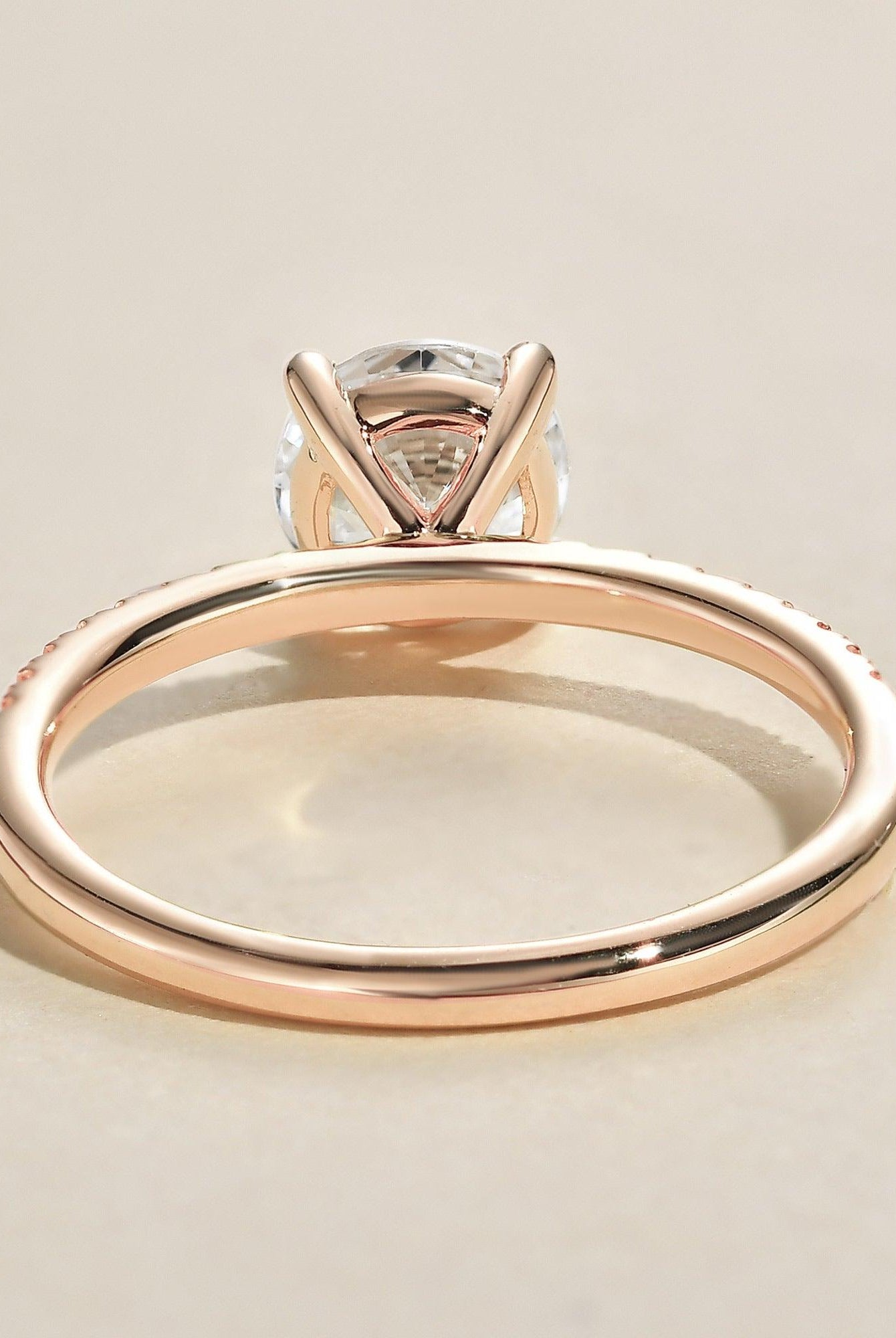round-cut-solitaire-pave-moissanite-engagement-ring