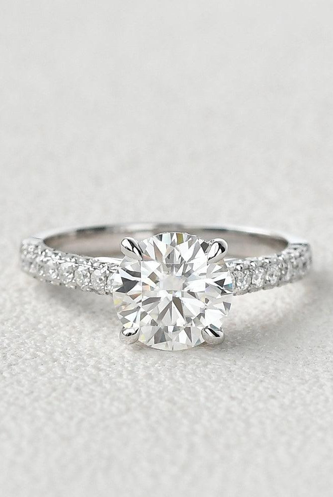 round-cut-solitaire-pave-moissanite-engagement-ring