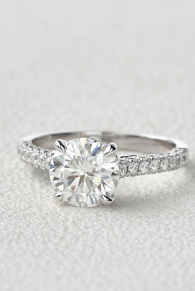round-cut-solitaire-pave-moissanite-engagement-ring