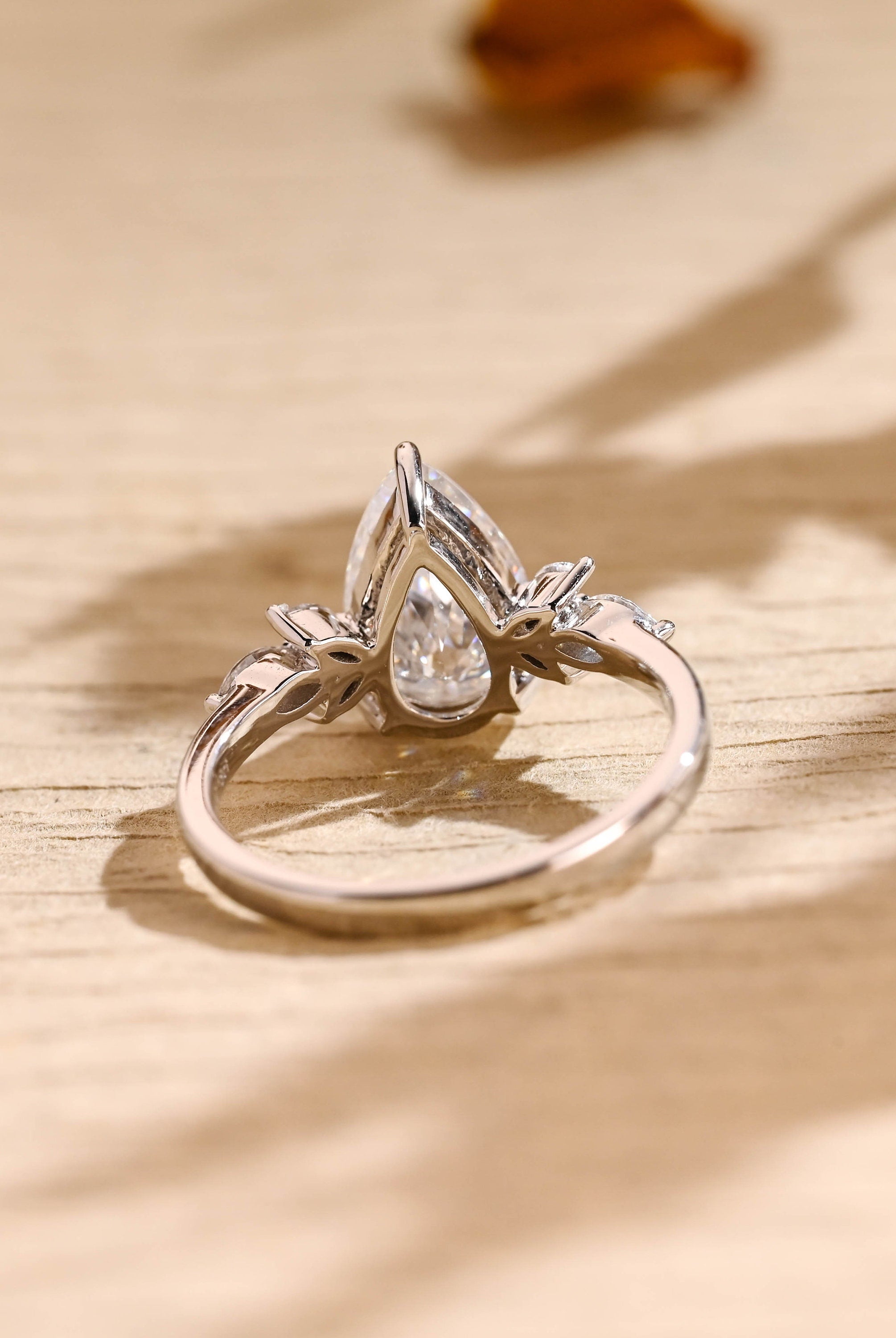 sustainable pear cluster engagement ring moissanite