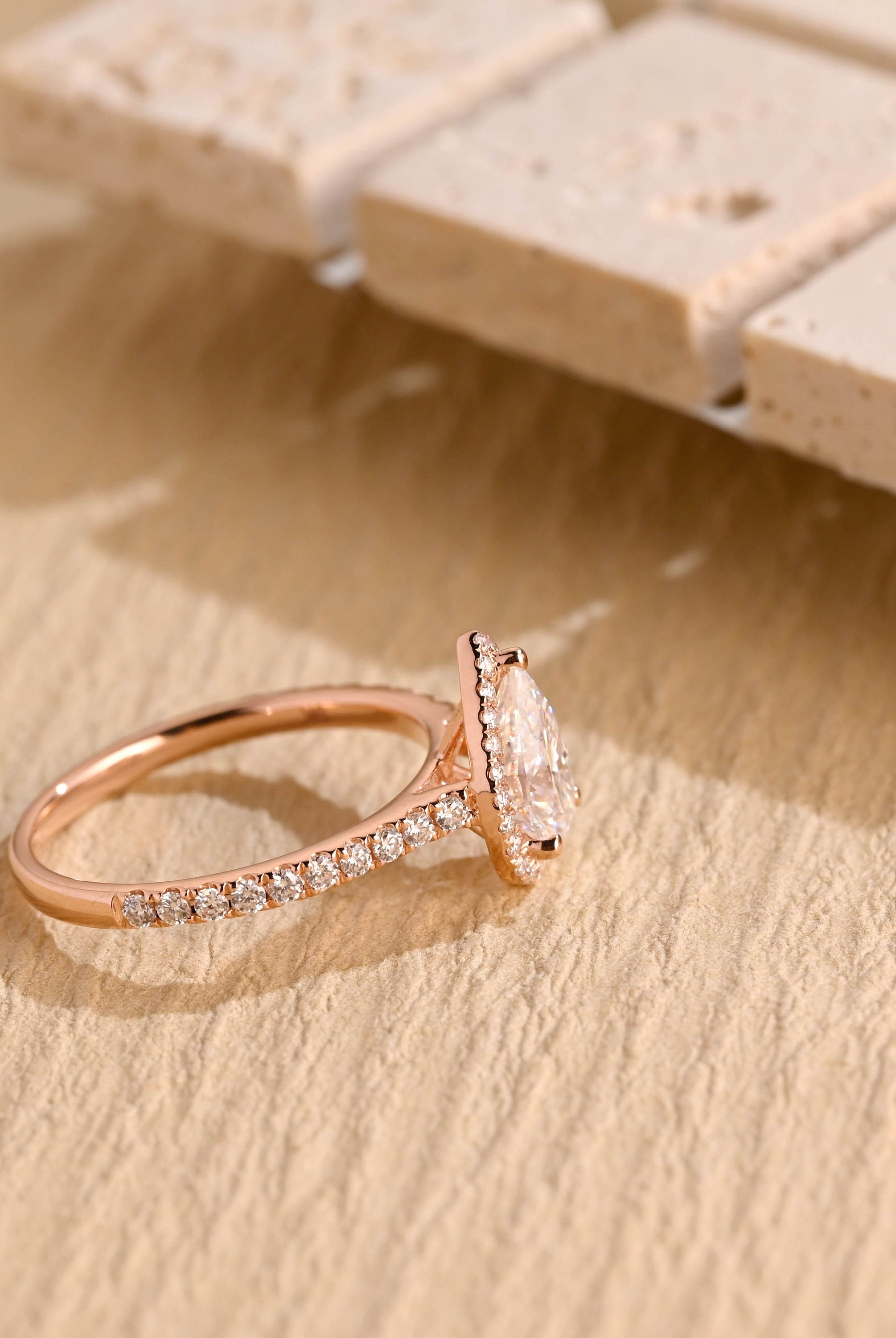 sparkling pear halo engagement ring moissanite