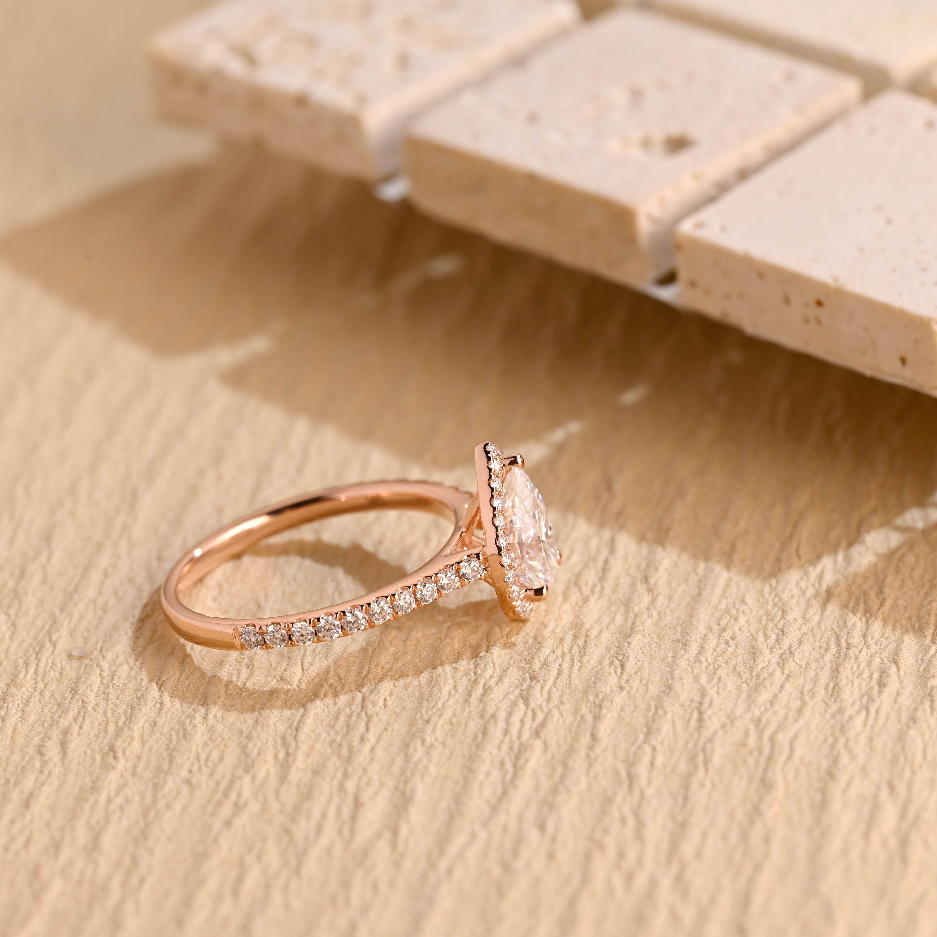 sparkling pear halo engagement ring moissanite