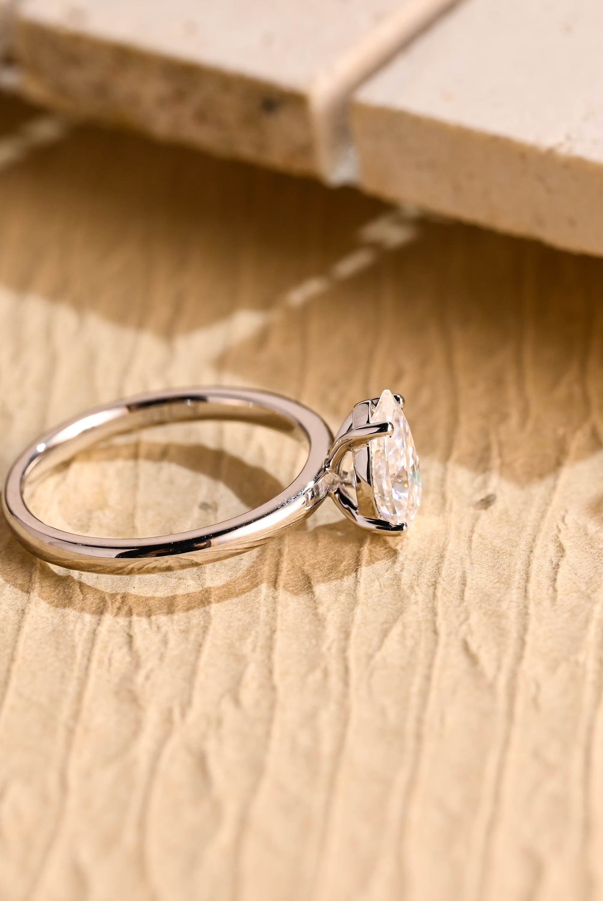 diamond alternative pear solitaire engagement ring
