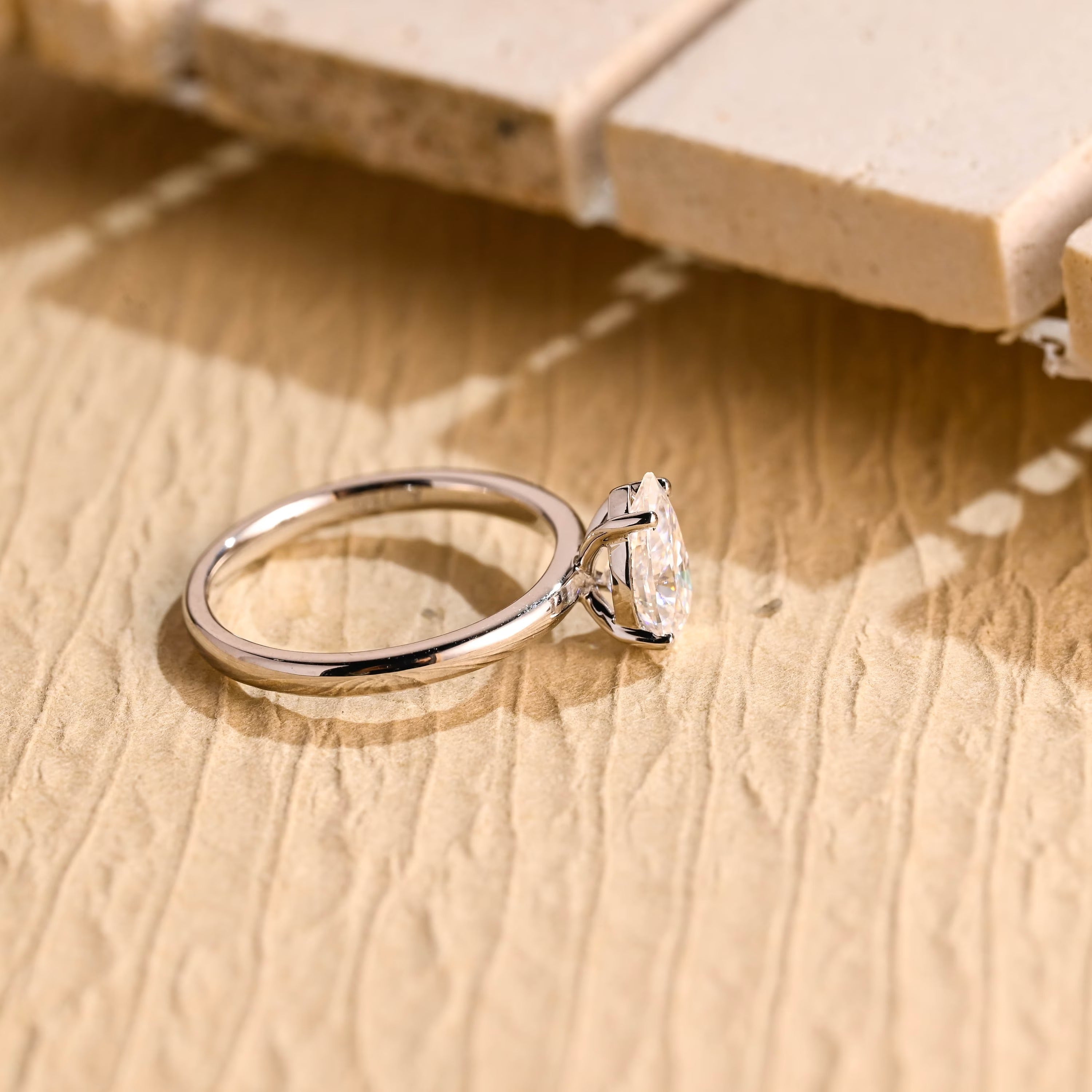 diamond alternative pear solitaire engagement ring