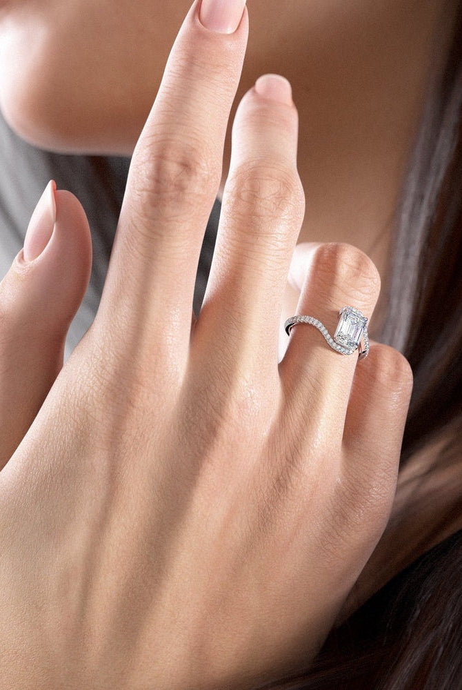 emerald-cut-solitaire-bypass-setting-moissanite-engagement-ring