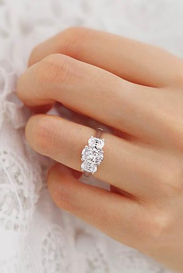 1-50-ct-oval-shaped-moissanite-three-stone-style-engagement-ring-1