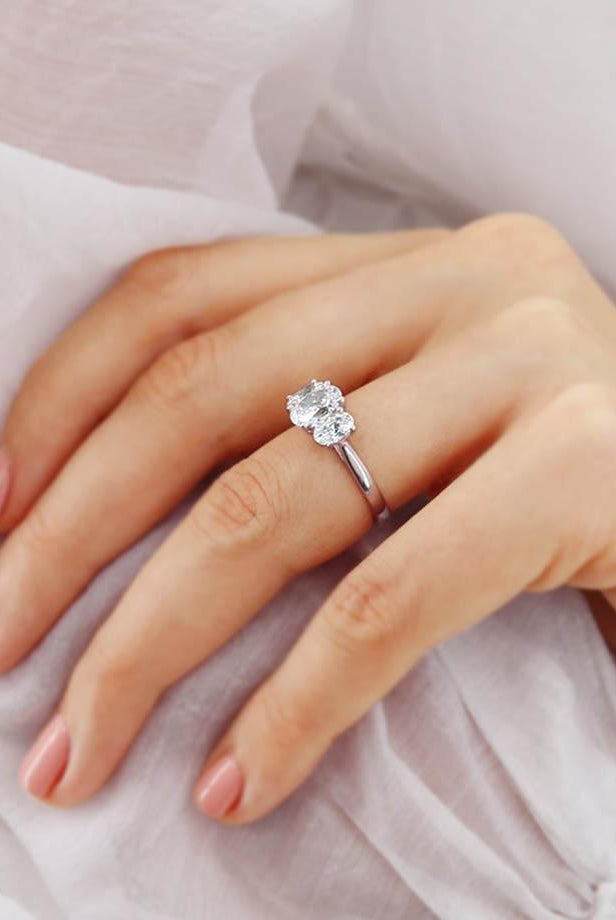oval-shaped-moissanite-three-stone-engagement-ring