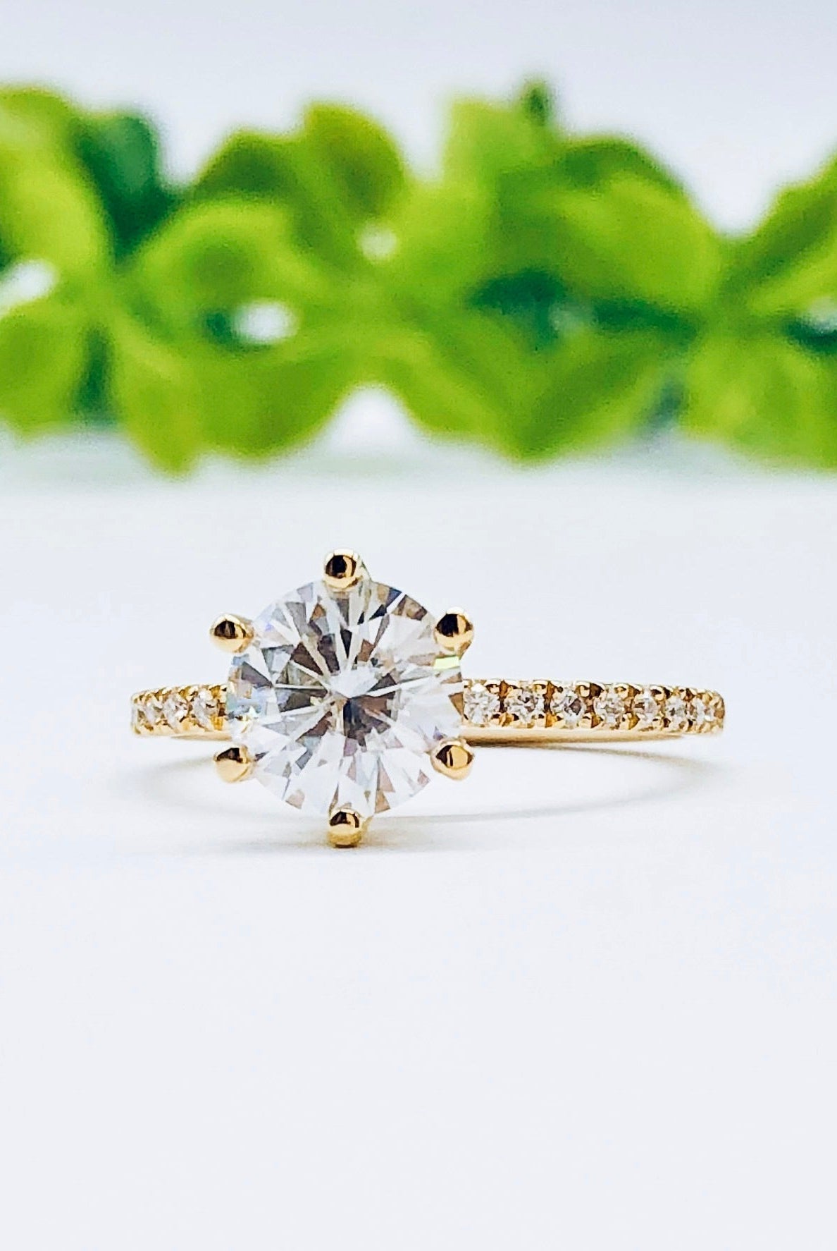 round-cut-solitaire-pave-moissanite-engagement-ring
