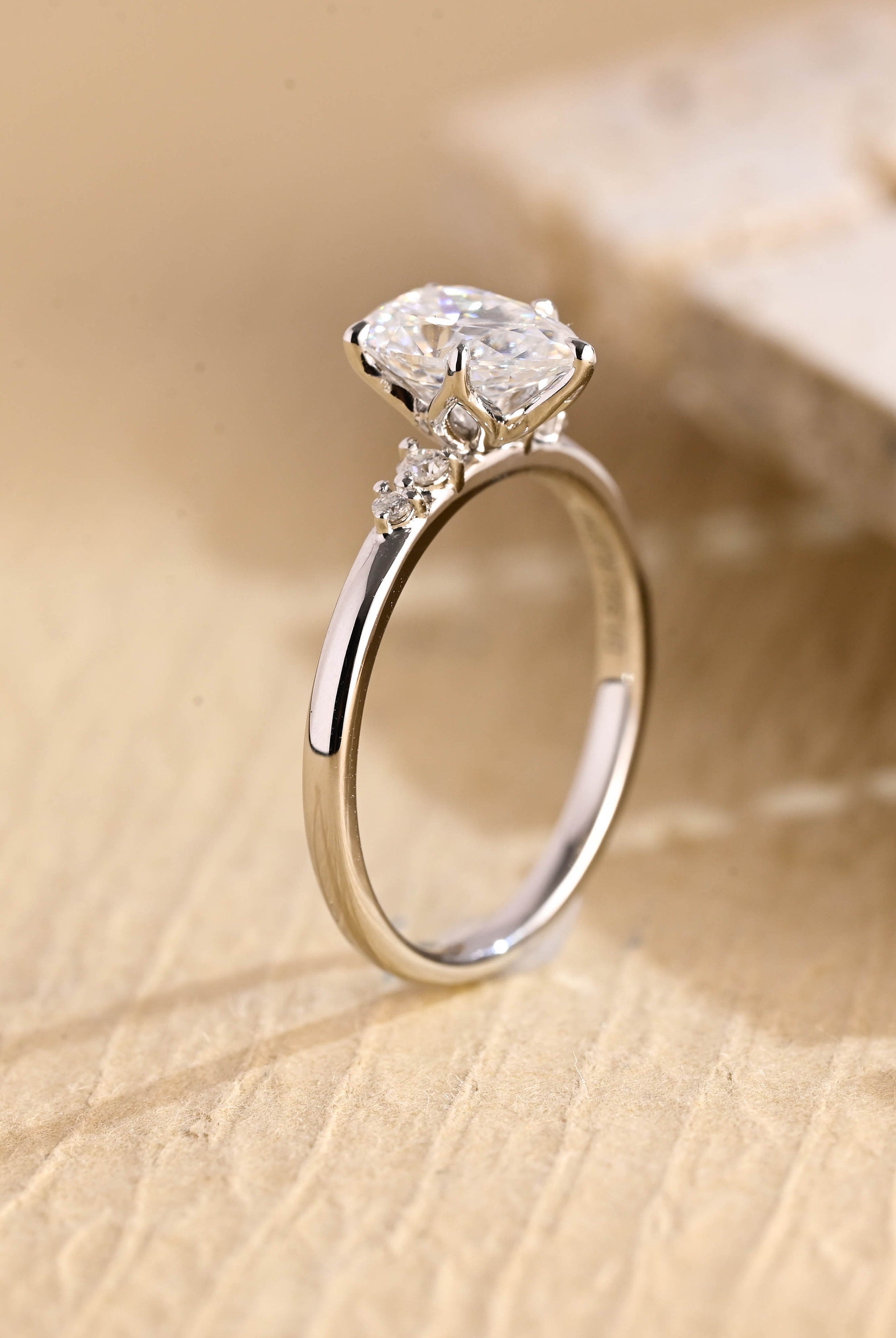 sustainable pear five stone engagement ring moissanite