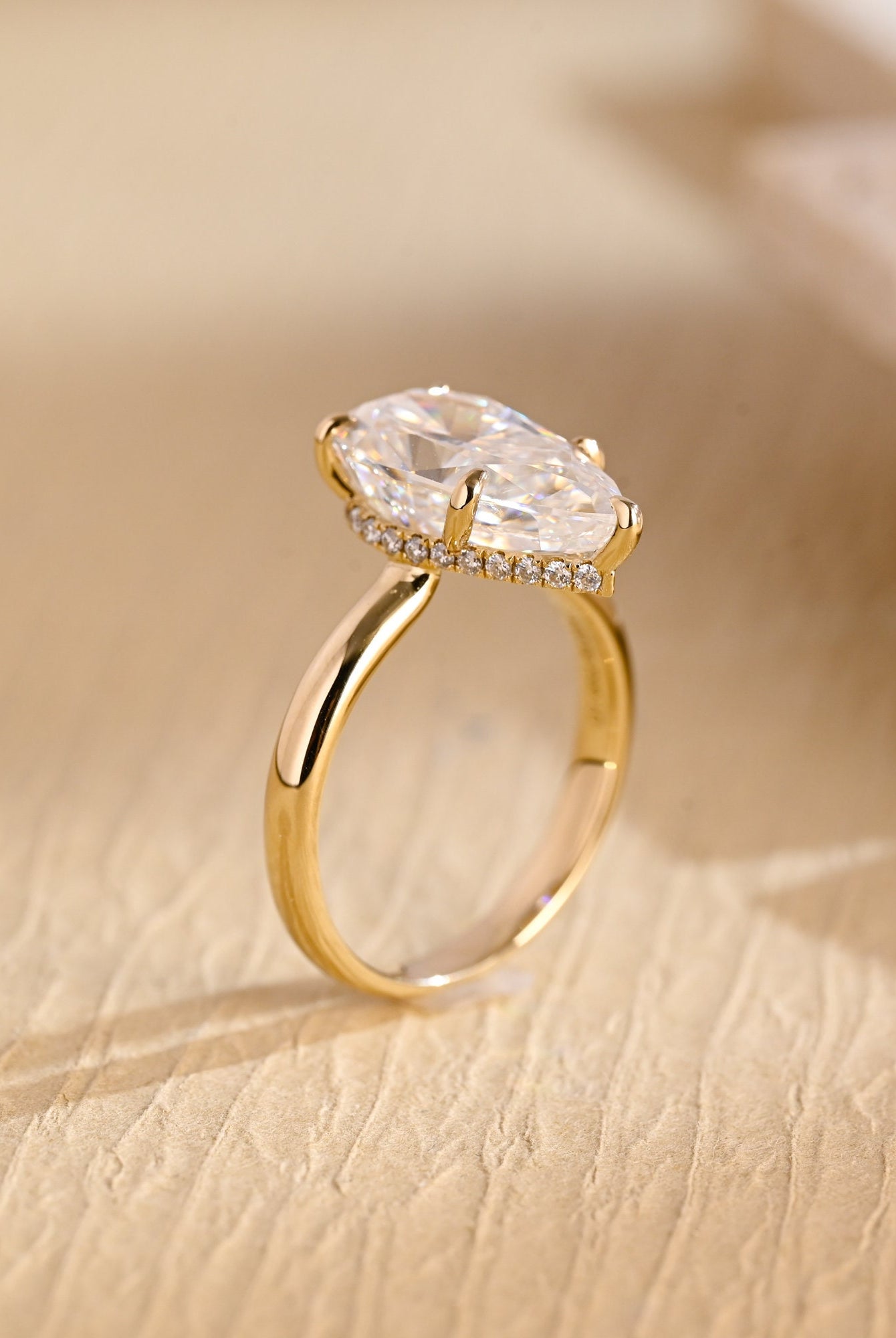 sustainable pear hidden halo engagement ring moissanite