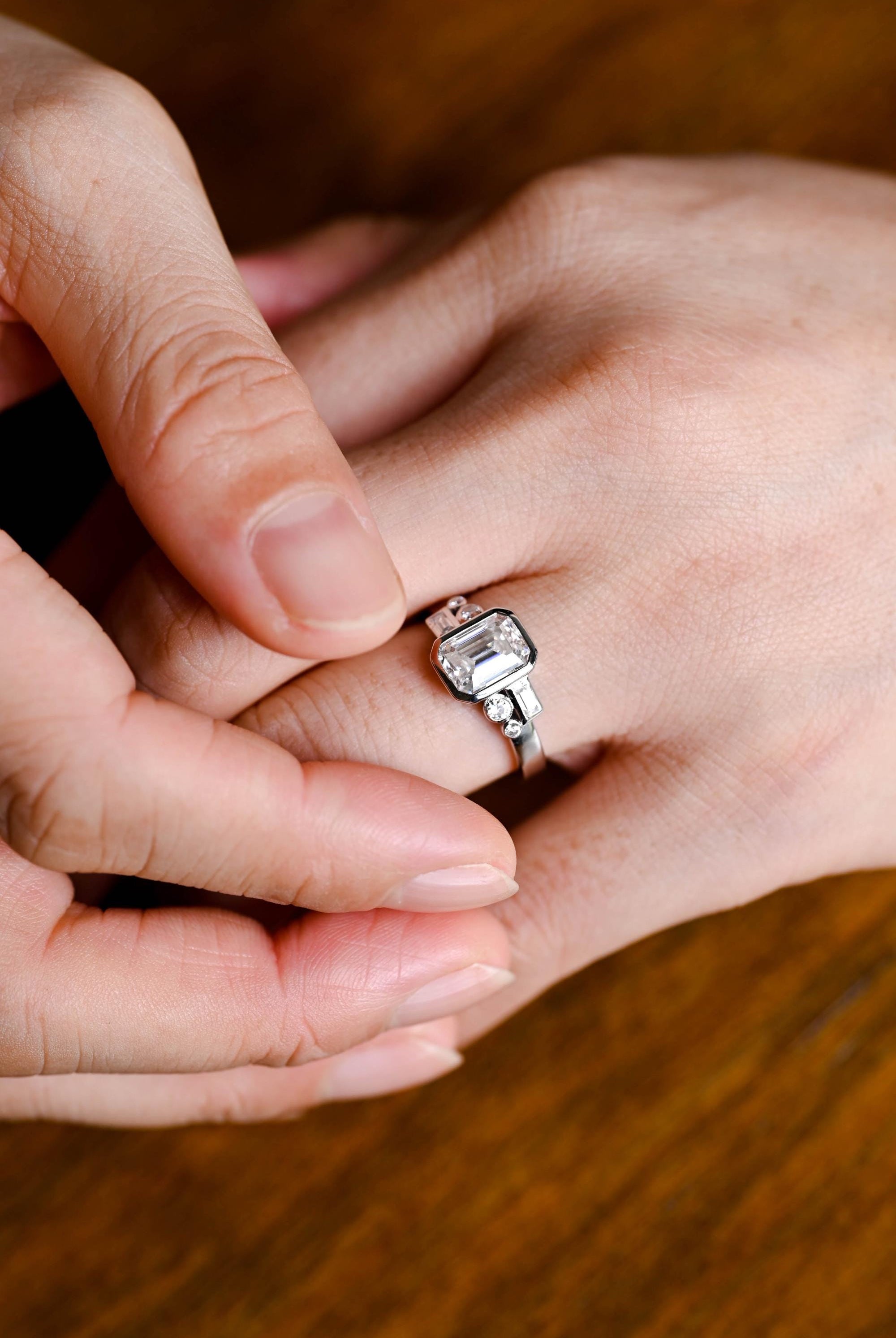 emerald shape bezel cluster engagement ring 1ct moissanite