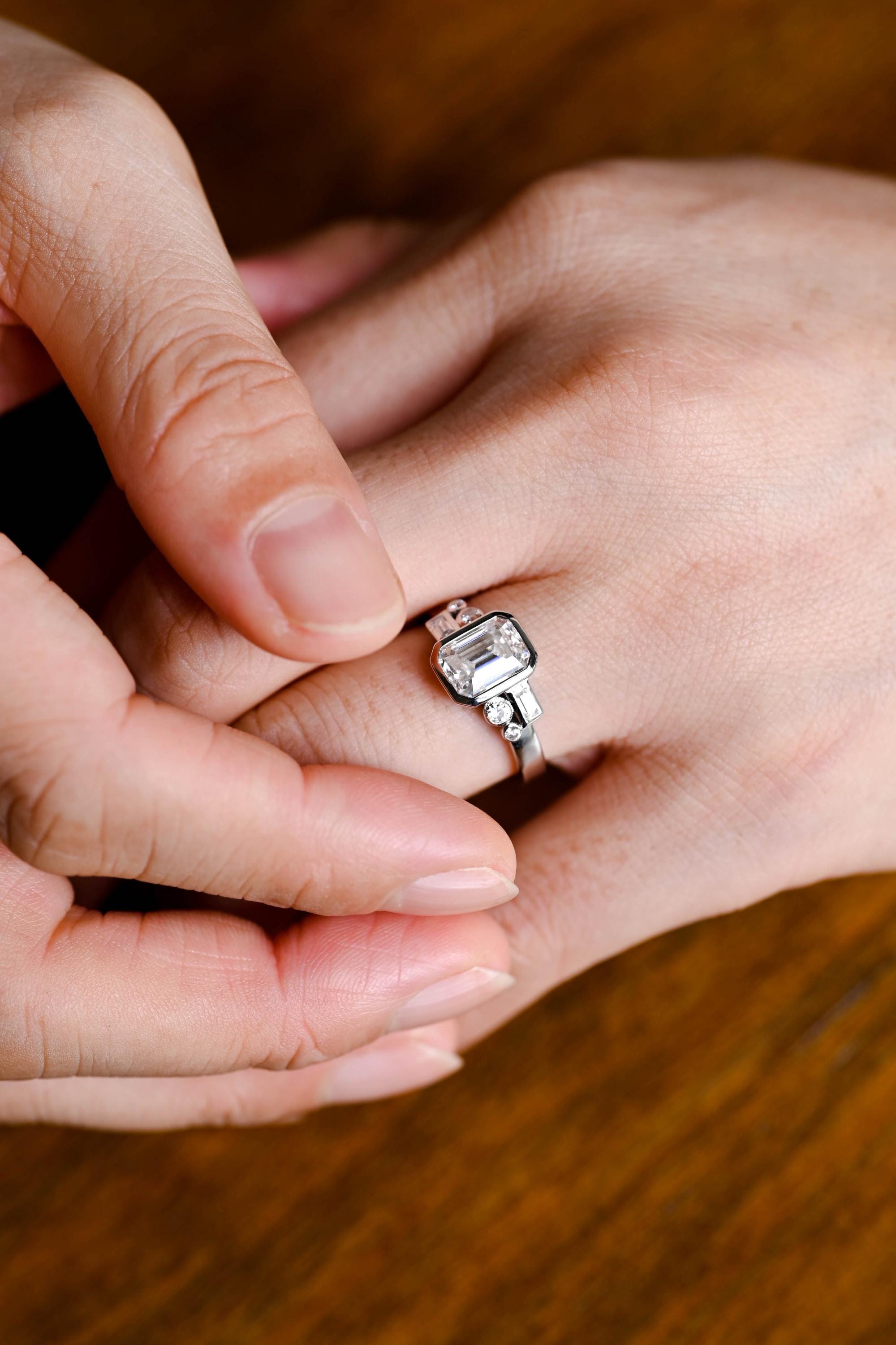 emerald shape bezel cluster engagement ring 1ct moissanite