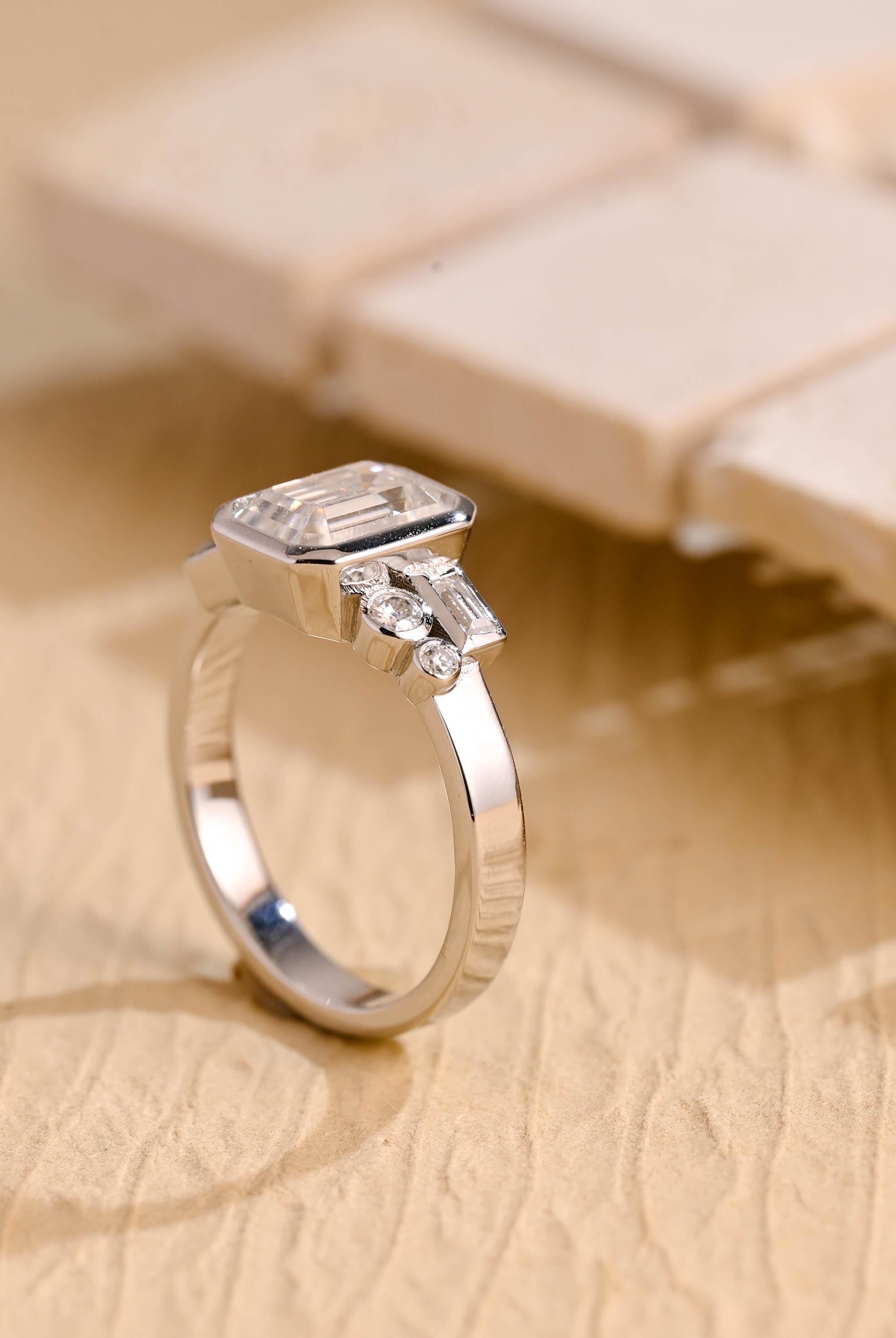 certified emerald cut bezel cluster moissanite ring