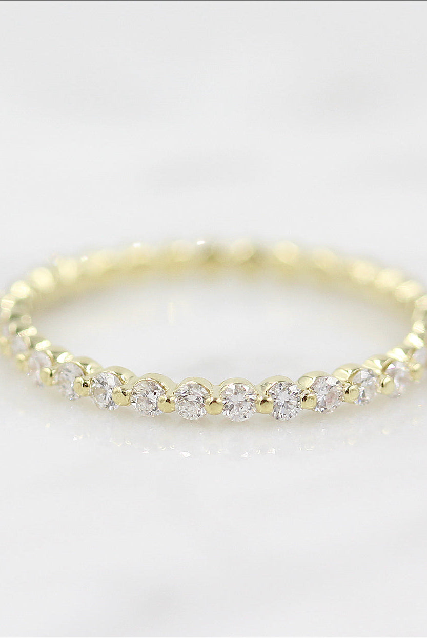 round-cut-half-eternity-moissanite-wedding-band