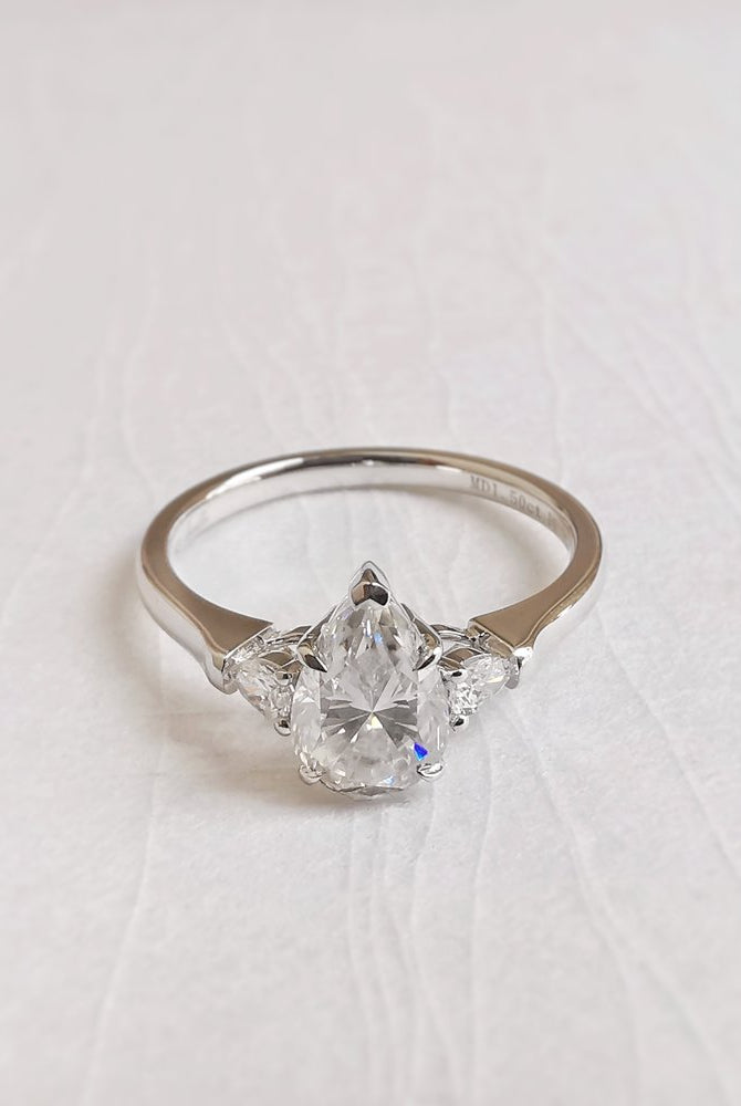 1-50-ct-pear-shaped-moissanite-three-stone-engagement-ring