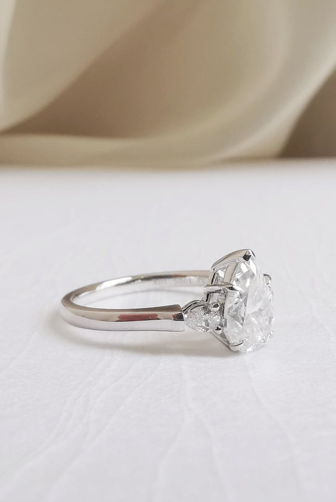 1-50-ct-pear-shaped-moissanite-three-stone-engagement-ring