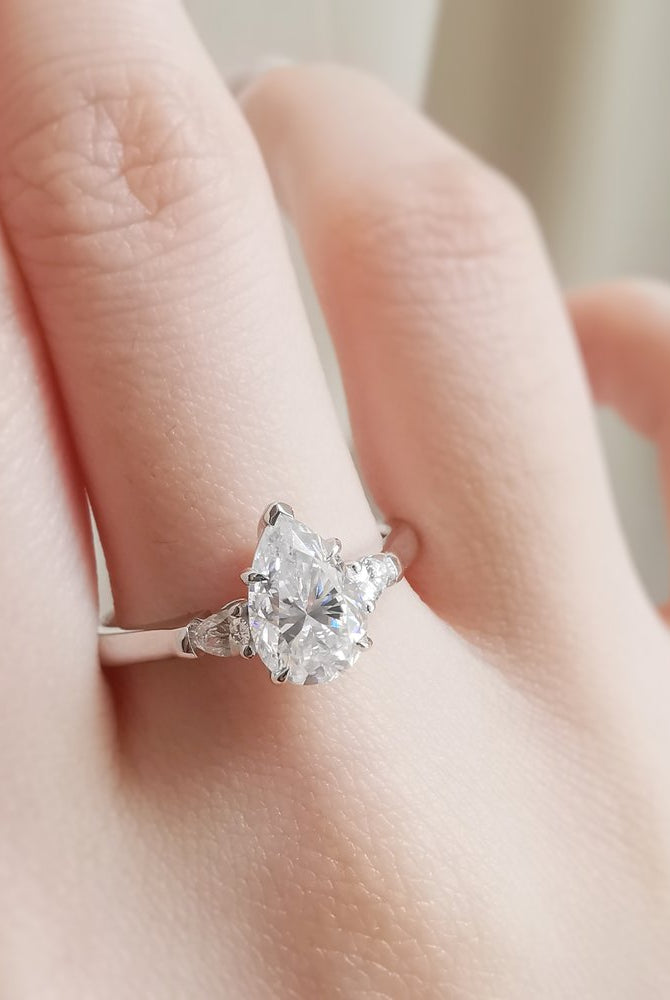 1-50-ct-pear-shaped-moissanite-three-stone-engagement-ring
