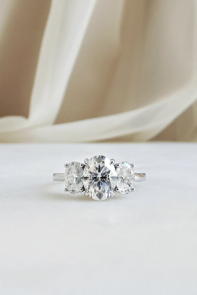 1-50-ct-oval-shaped-moissanite-three-stone-engagement-ring