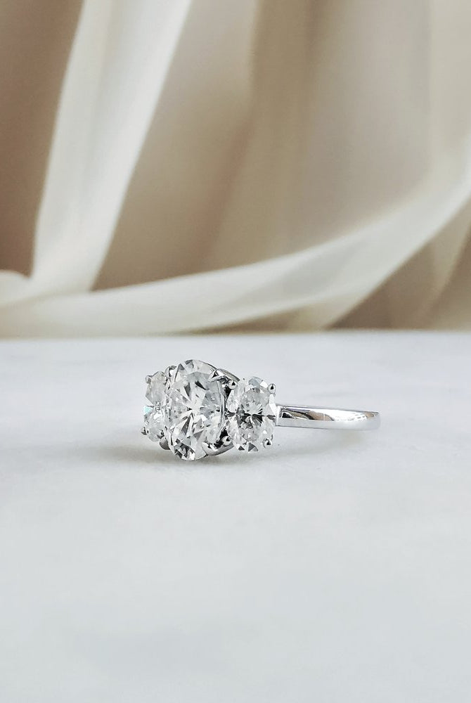 1-50-ct-oval-shaped-moissanite-three-stone-engagement-ring