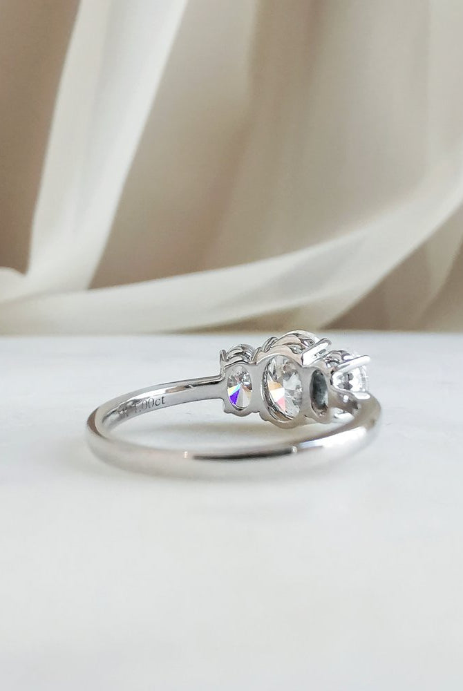 1-50-ct-oval-shaped-moissanite-three-stone-engagement-ring