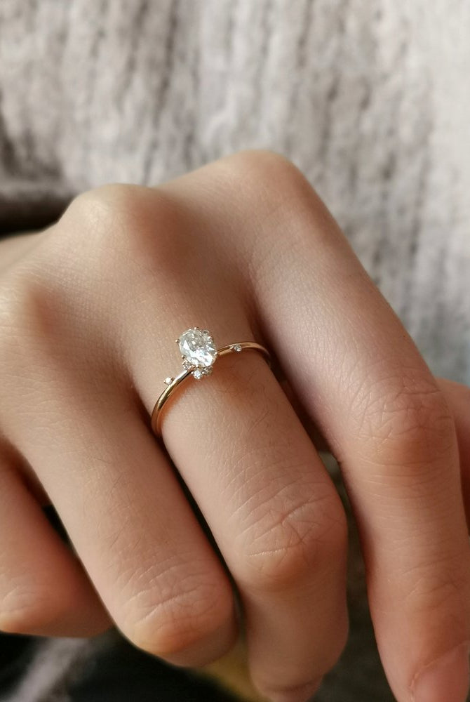 0-50-ct-oval-shaped-moissanite-cluster-engagement-ring