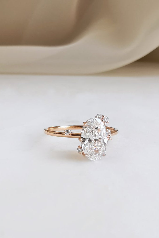 0-50-ct-oval-shaped-moissanite-cluster-engagement-ring