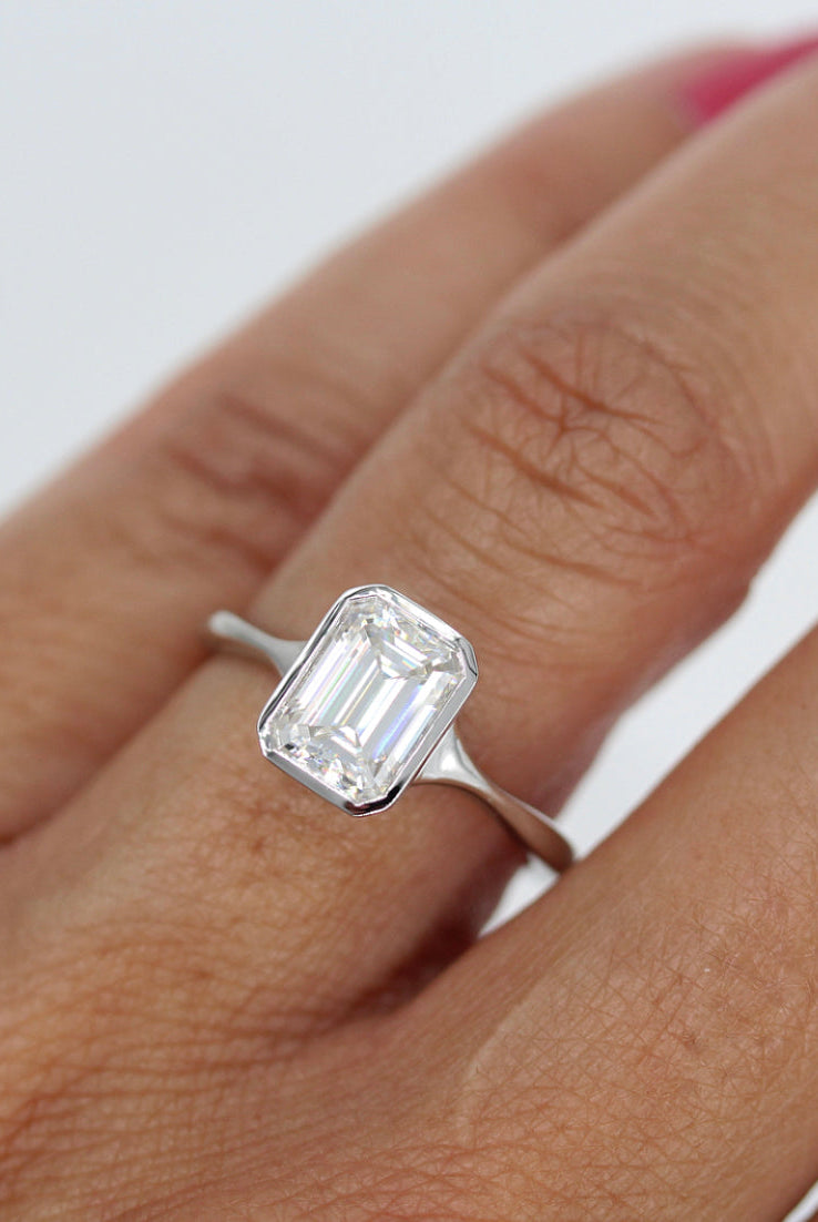 Moissanite engagement ring with side stones