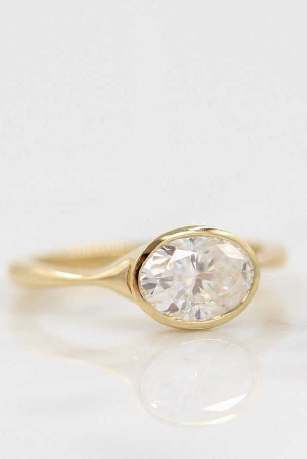 Vintage-inspired cushion cut moissanite engagement rings with diamond accents