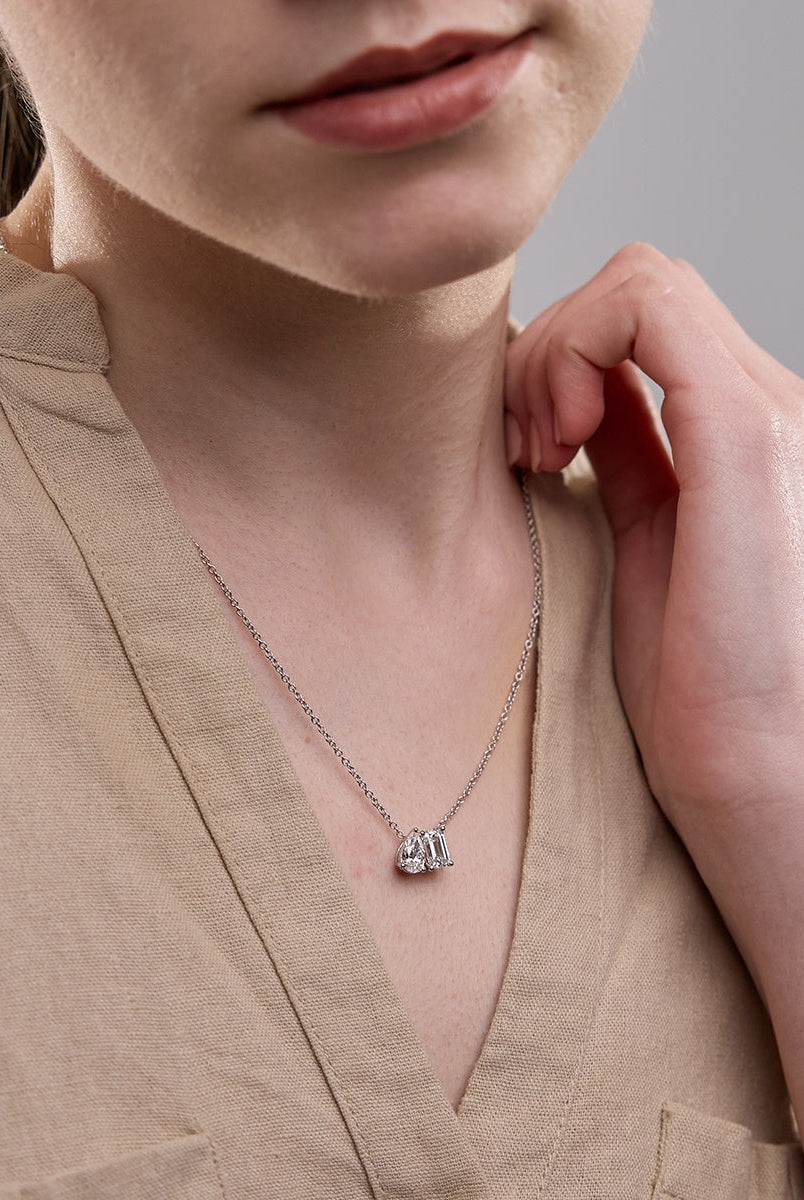 2-22-tcw-emerald-pear-moissanite-diamond-two-stone-necklace