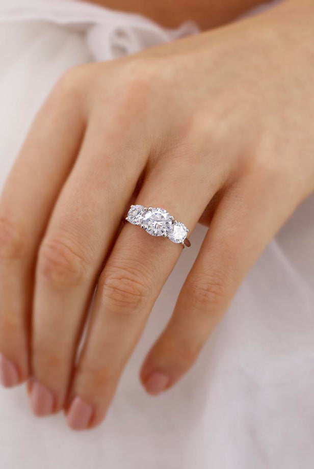 1-50-ct-round-shaped-moissanite-three-stone-engagement-ring