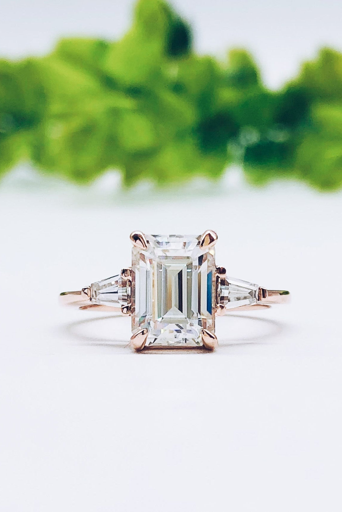 emerald-cut-three-stone-moissanite-engagement-ring