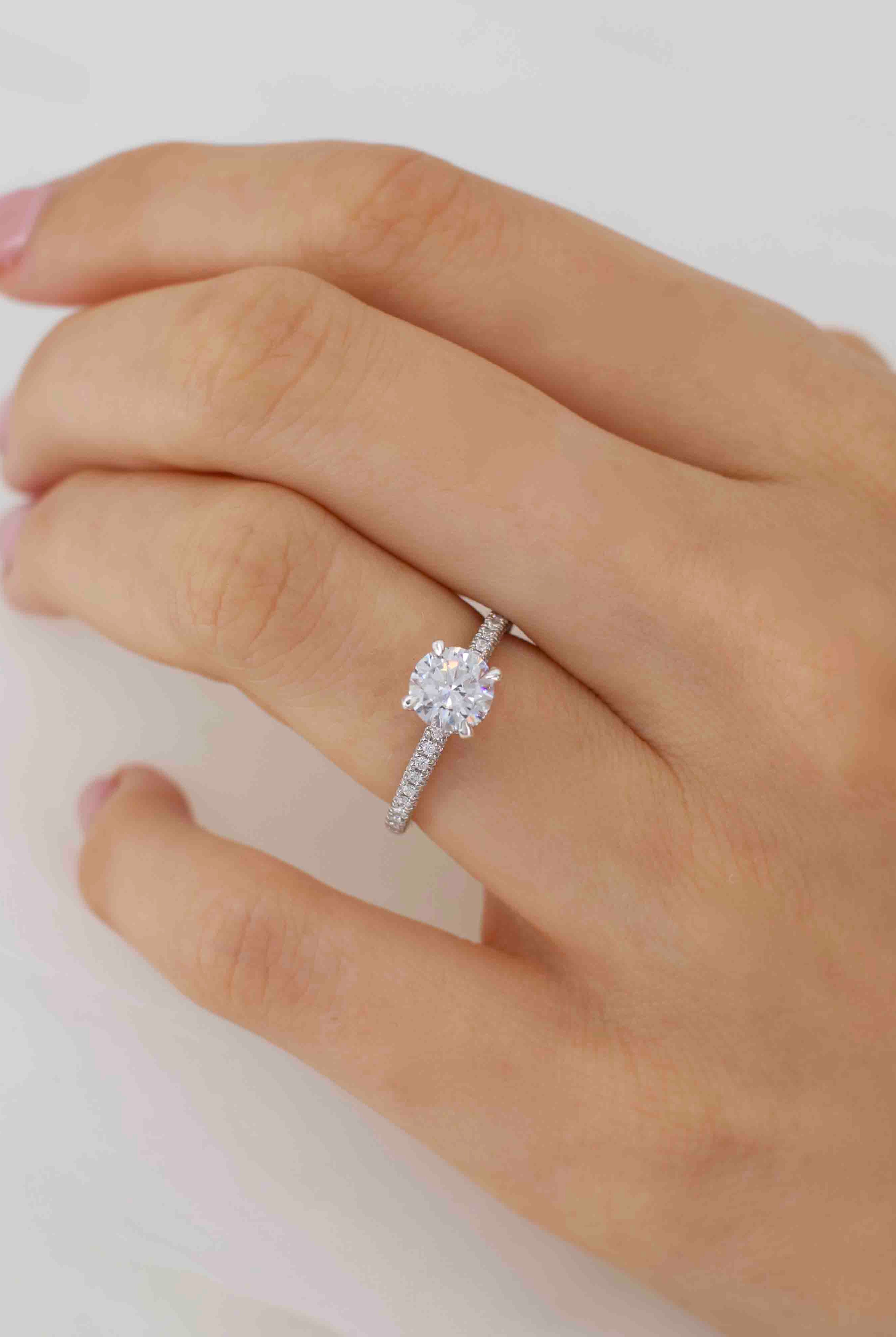 round-shaped-moissanite-hidden-halo-style-engagement-ring