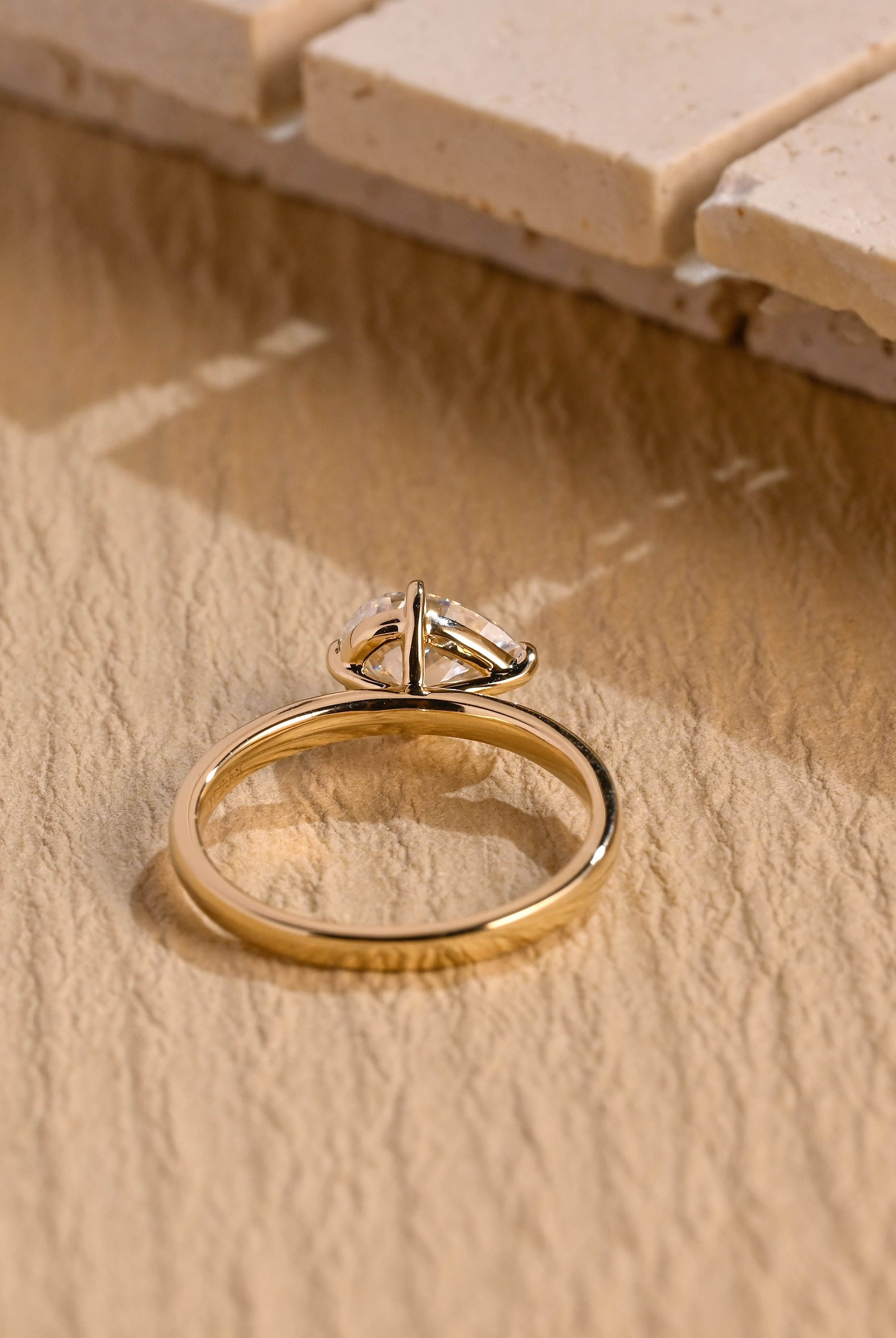 east west style moissanite engagement ring pear shape