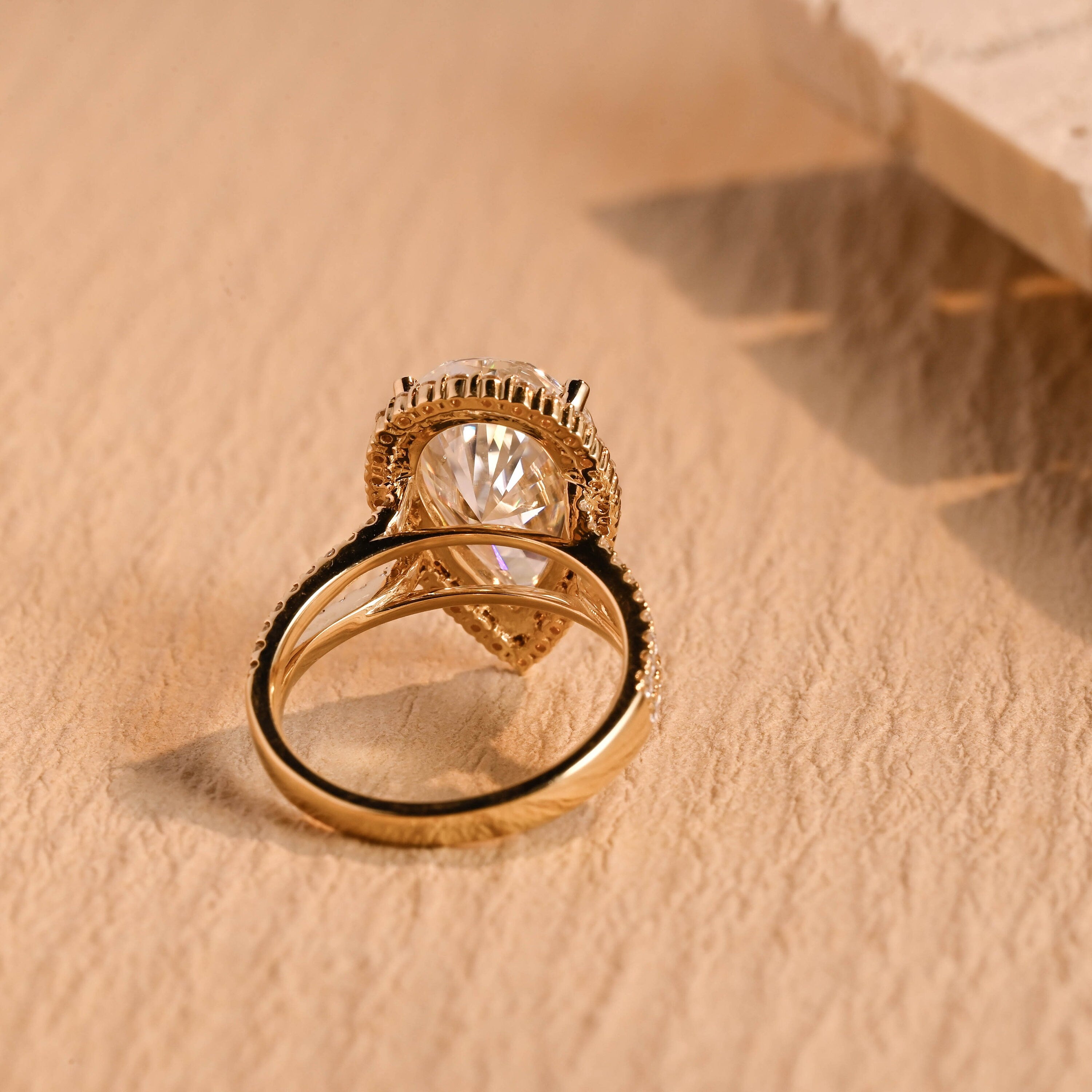 diamond halo pear shape moissanite ring