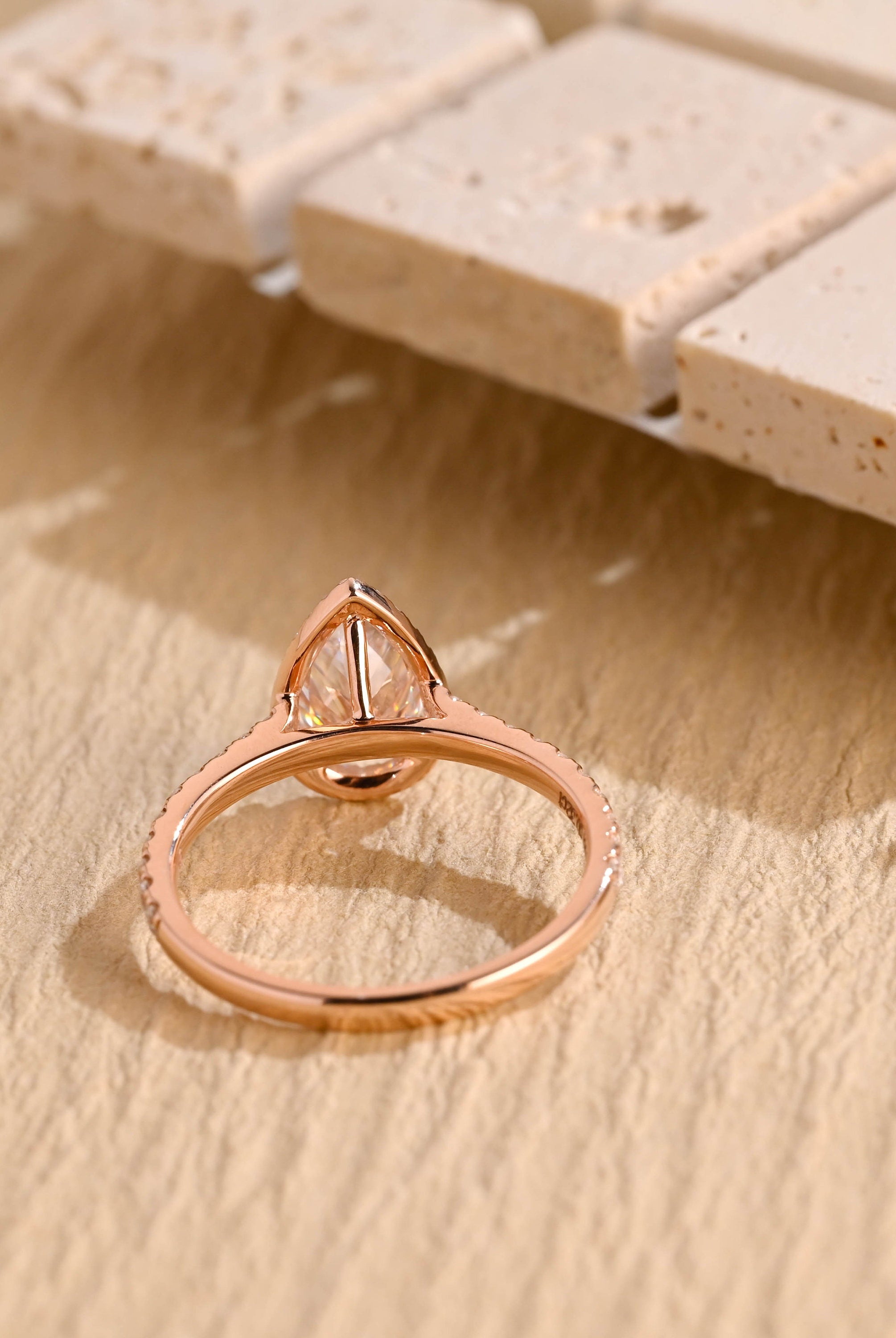 designer pear halo pavé moissanite ring