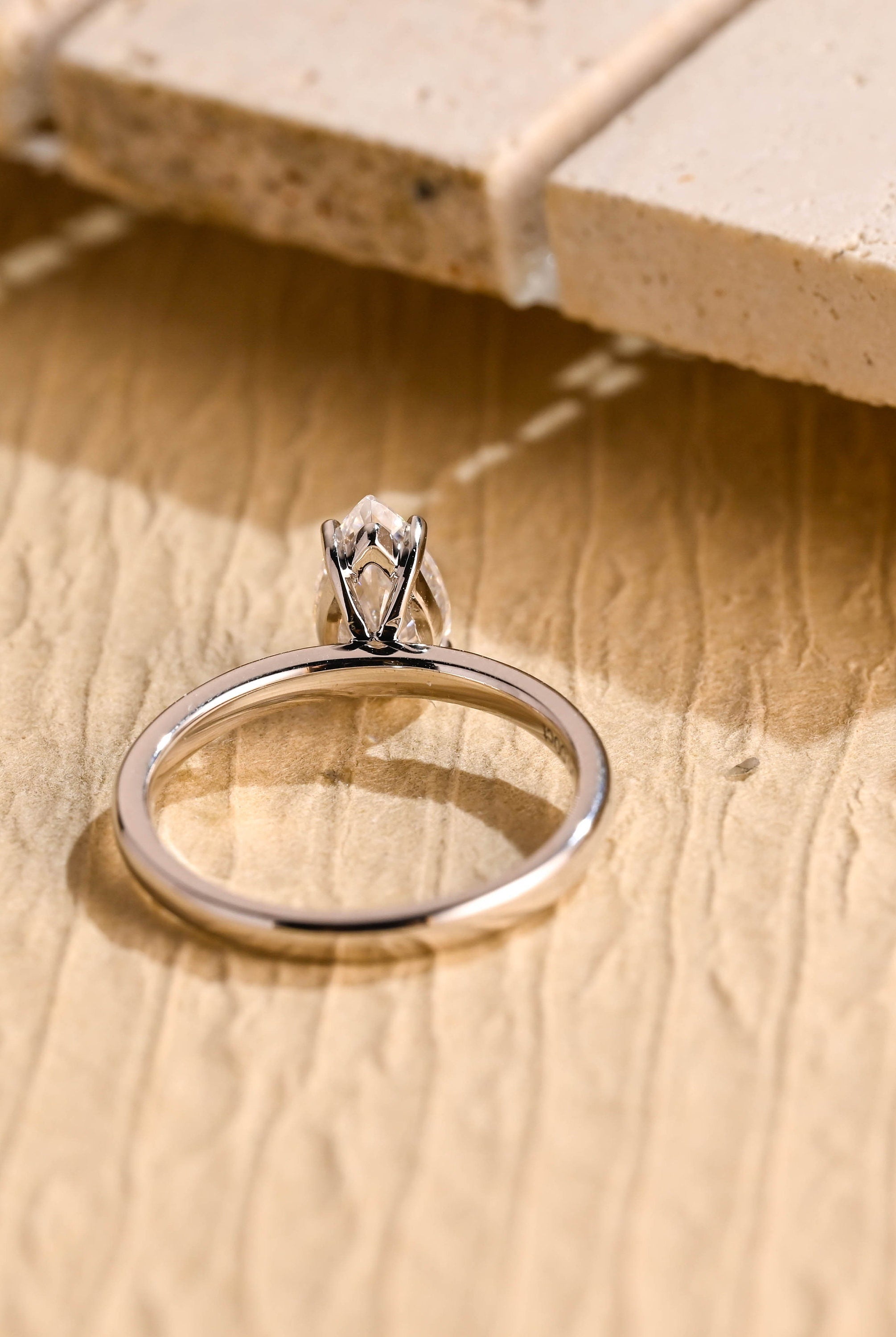 diamond alternative pear solitaire engagement ring
