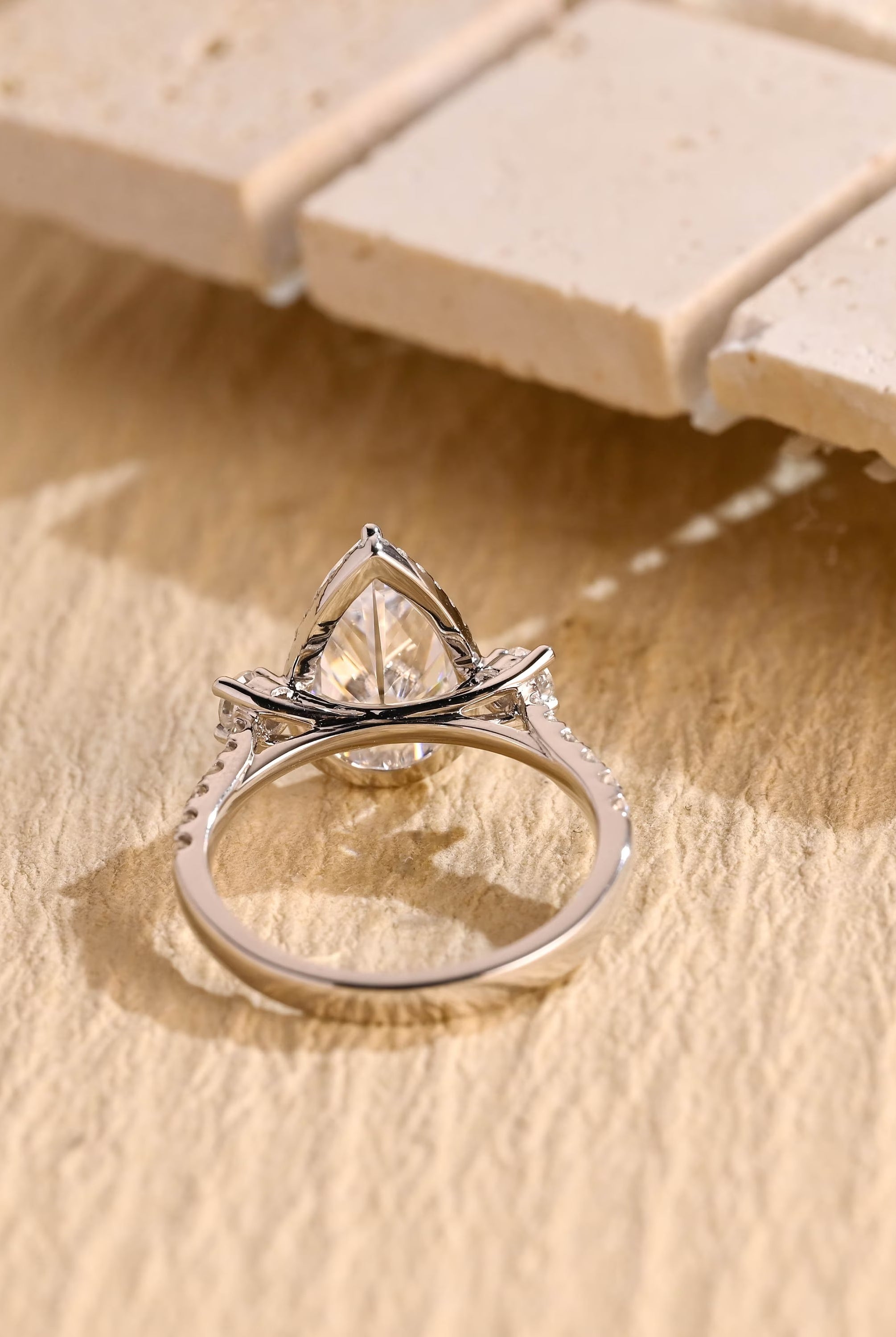 diamond alternative pear three stone engagement ring