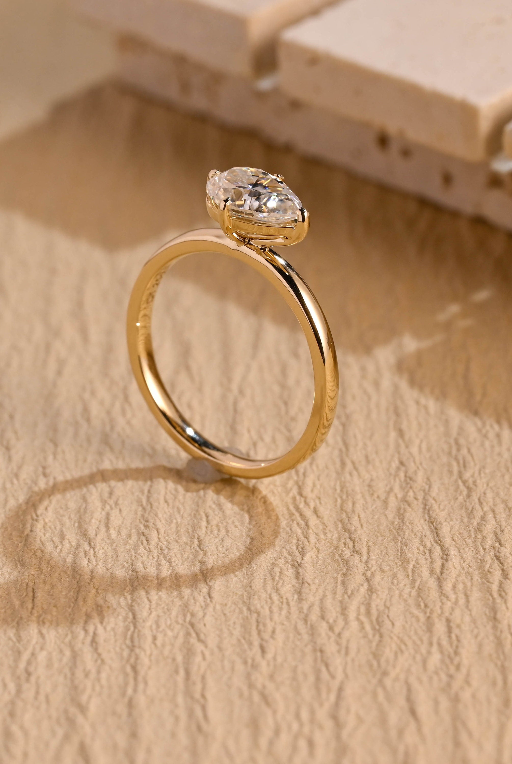 sustainable east west pear engagement ring moissanite