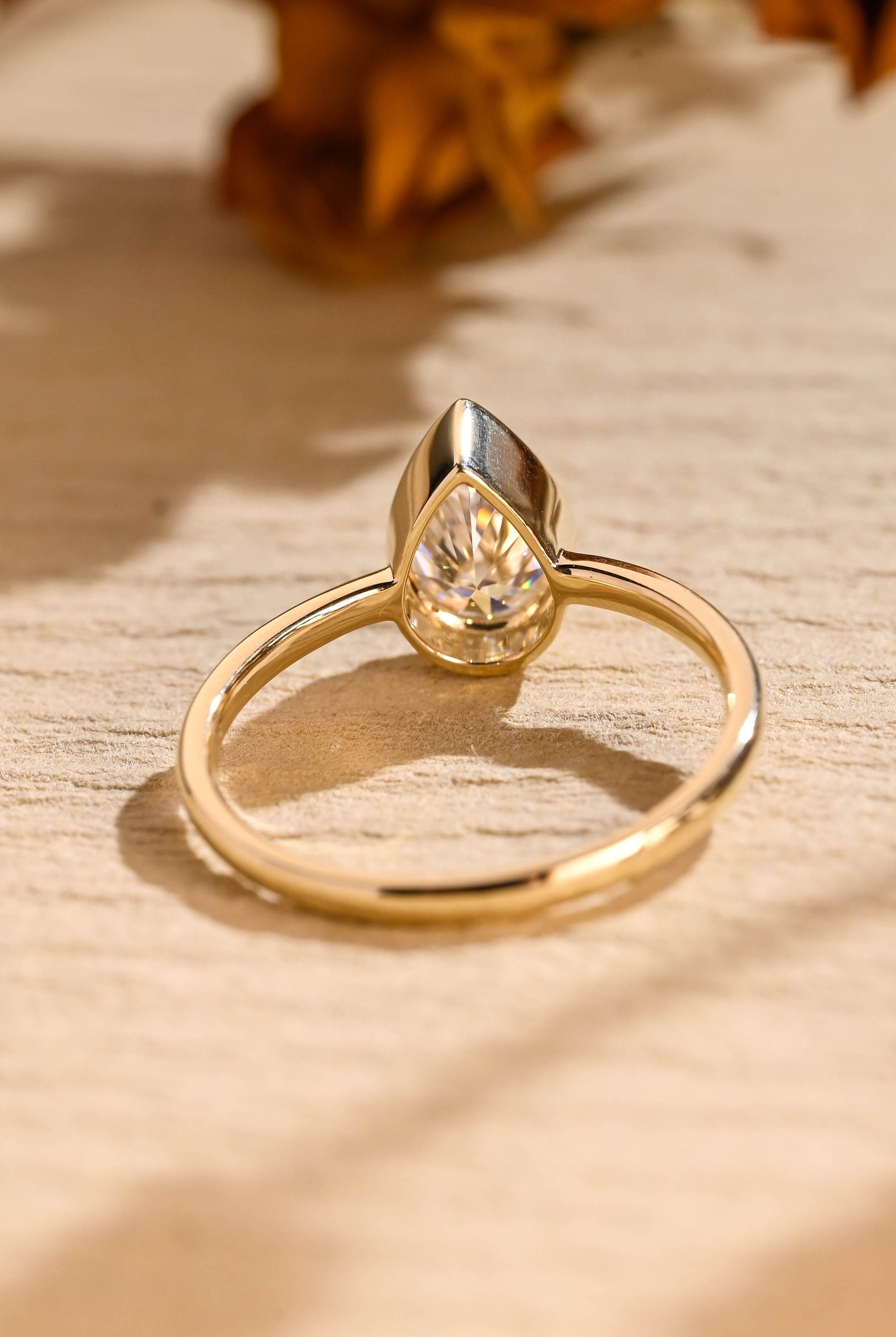 diamond alternative pear bezel engagement ring