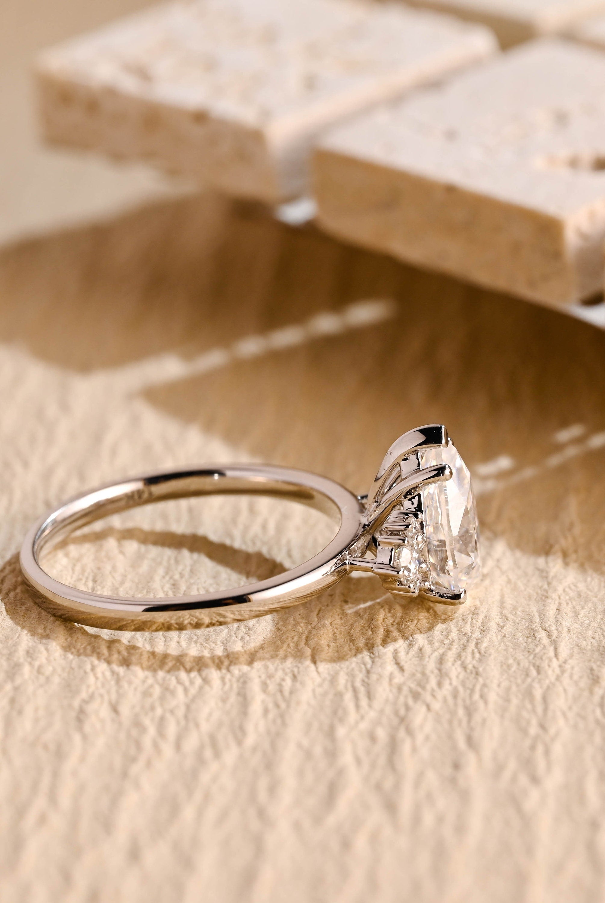 lab grown pear cluster engagement ring