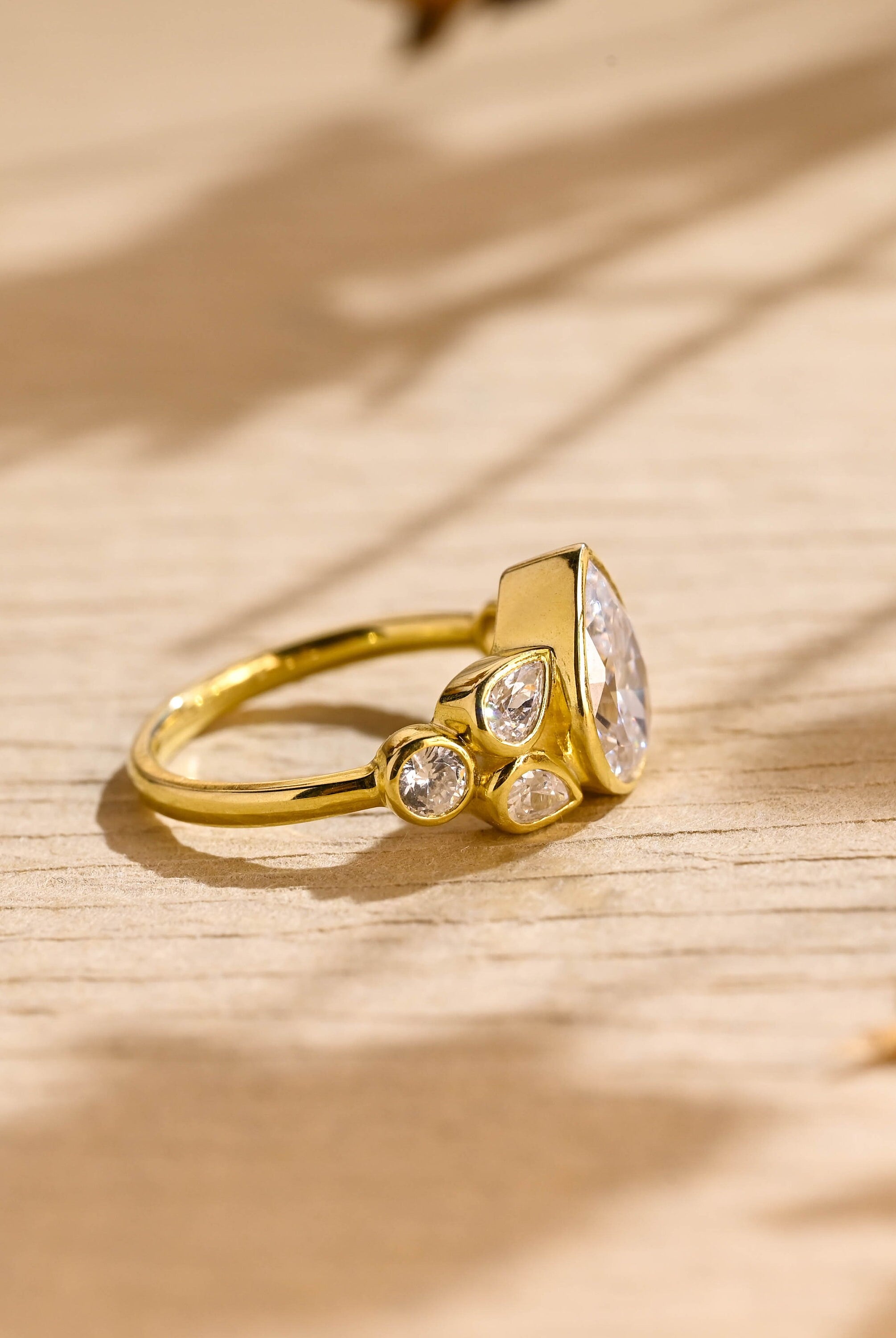 ethical pear cut seven stone moissanite engagement ring