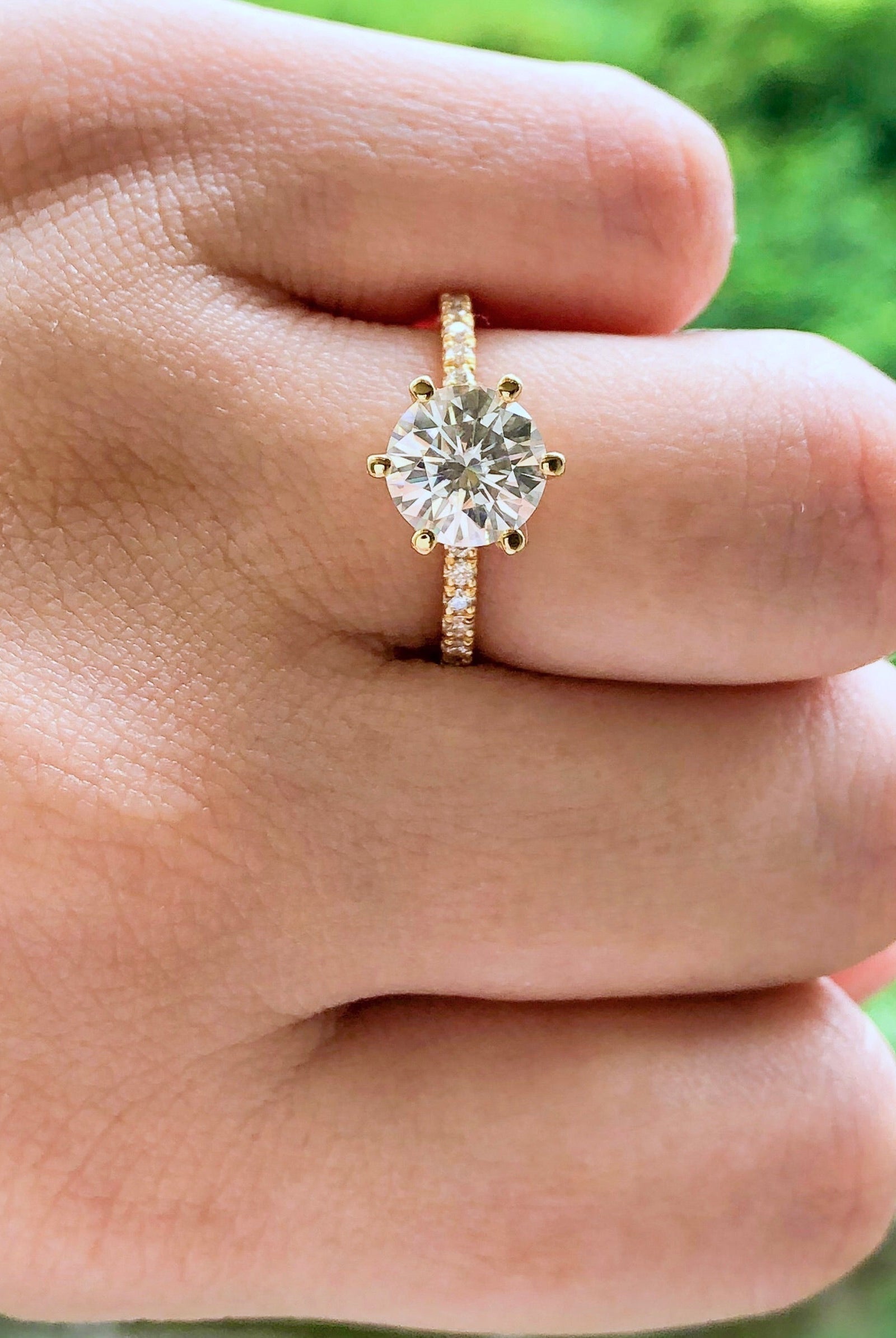 round-cut-solitaire-pave-moissanite-engagement-ring